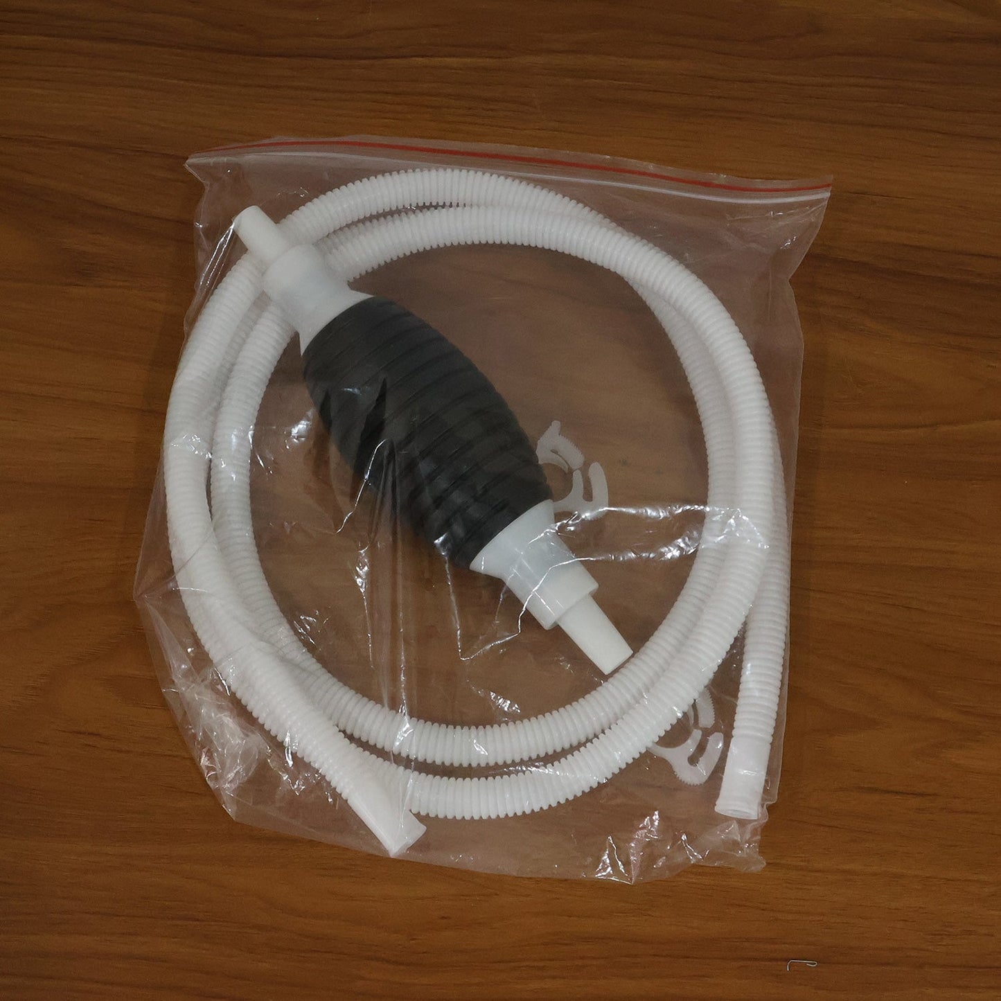 Hand squeeze bulb part of manual liquid transfer pump set