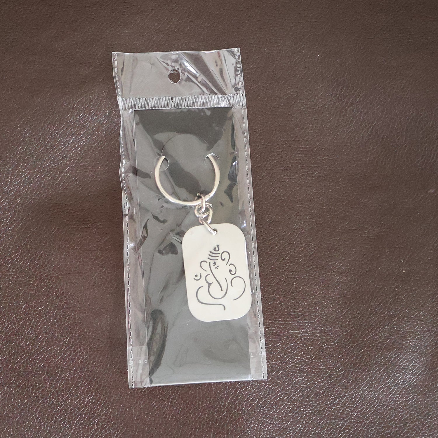 Back view of the Ganesh Metal Keychain, showing its smooth edges and premium finish.