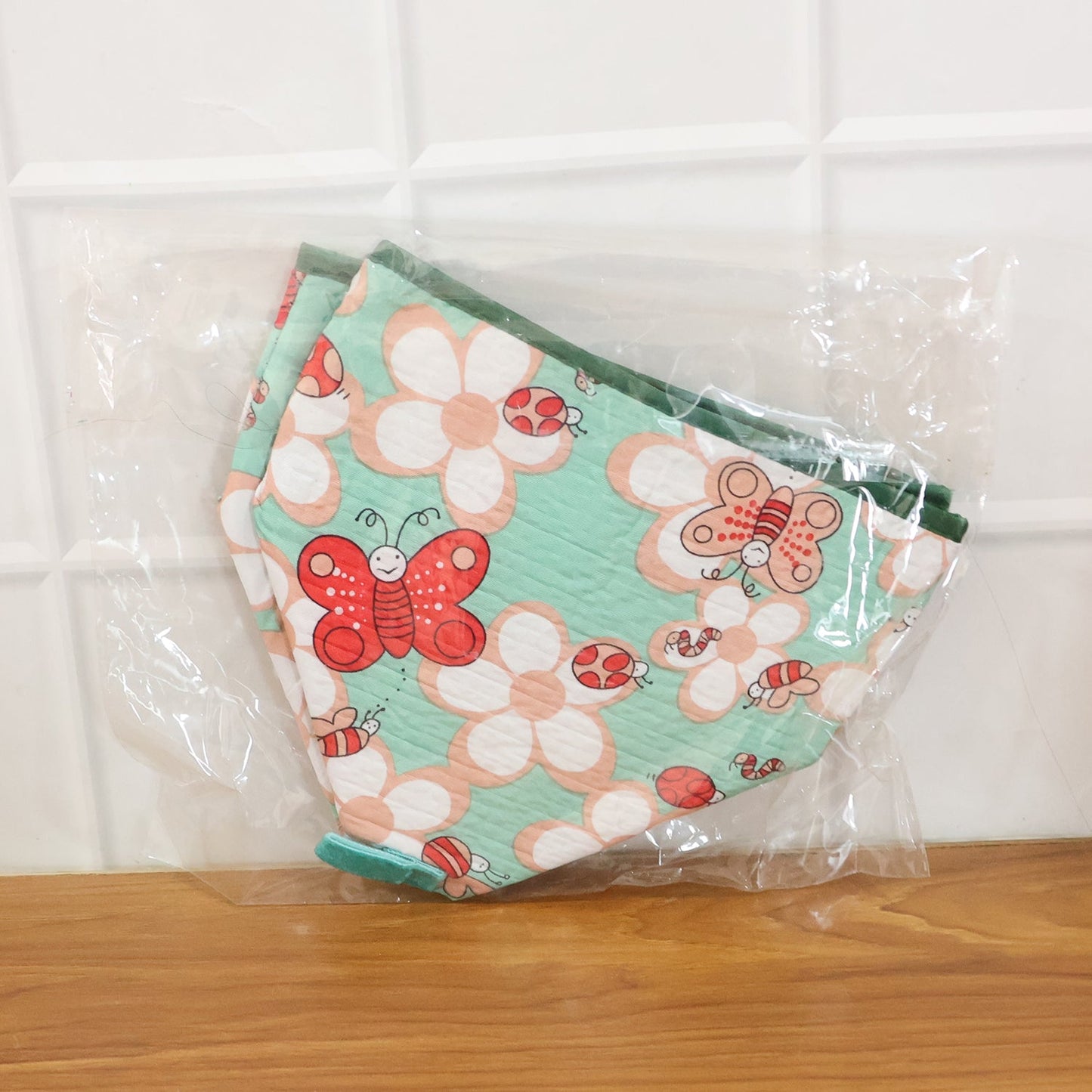 Compact collapsible food cover with decorative butterfly print