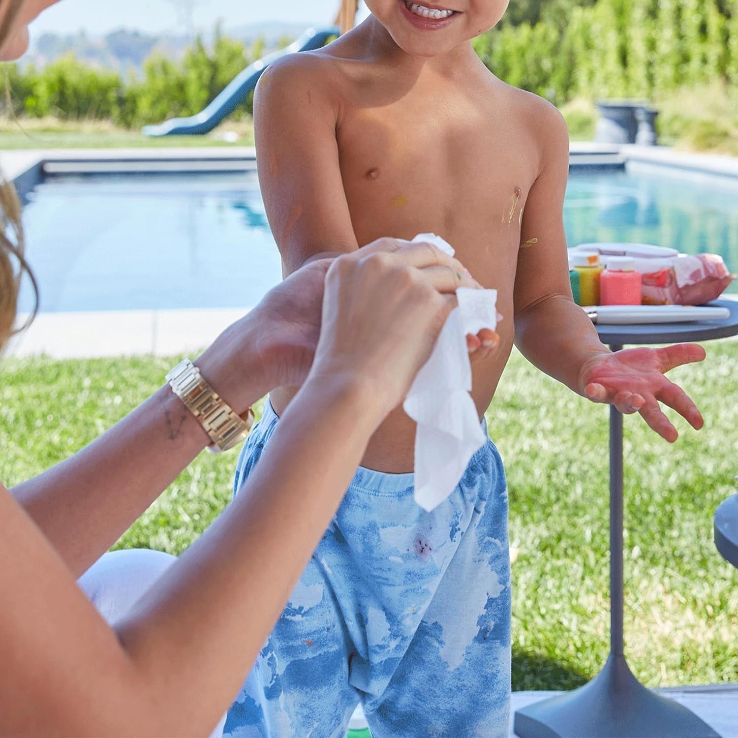 Close-up of a facial cleansing wipe with water droplets, emphasizing its hydrating properties.