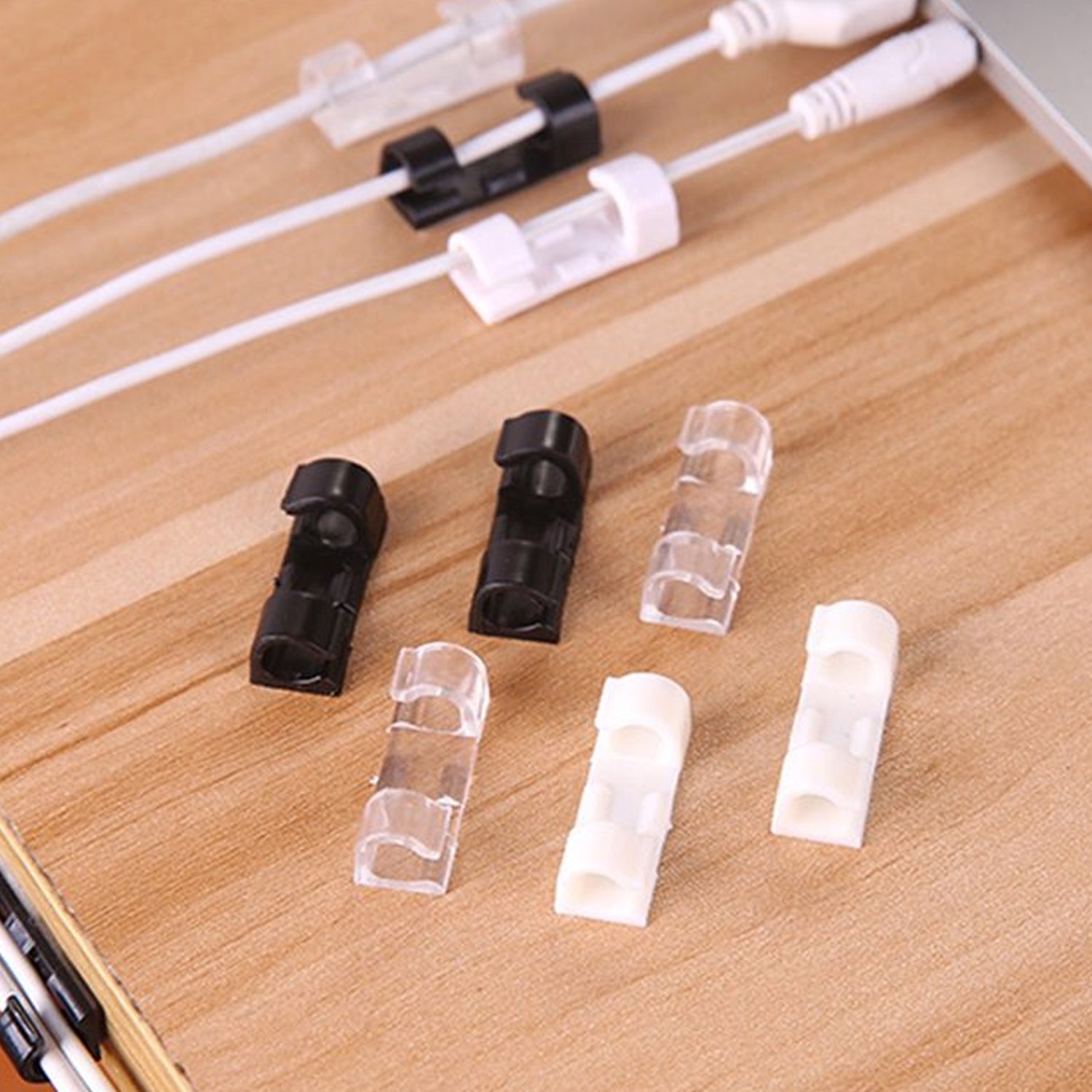 Plastic cable clips managing wires on a car dashboard, keeping vehicle interiors clutter-free.