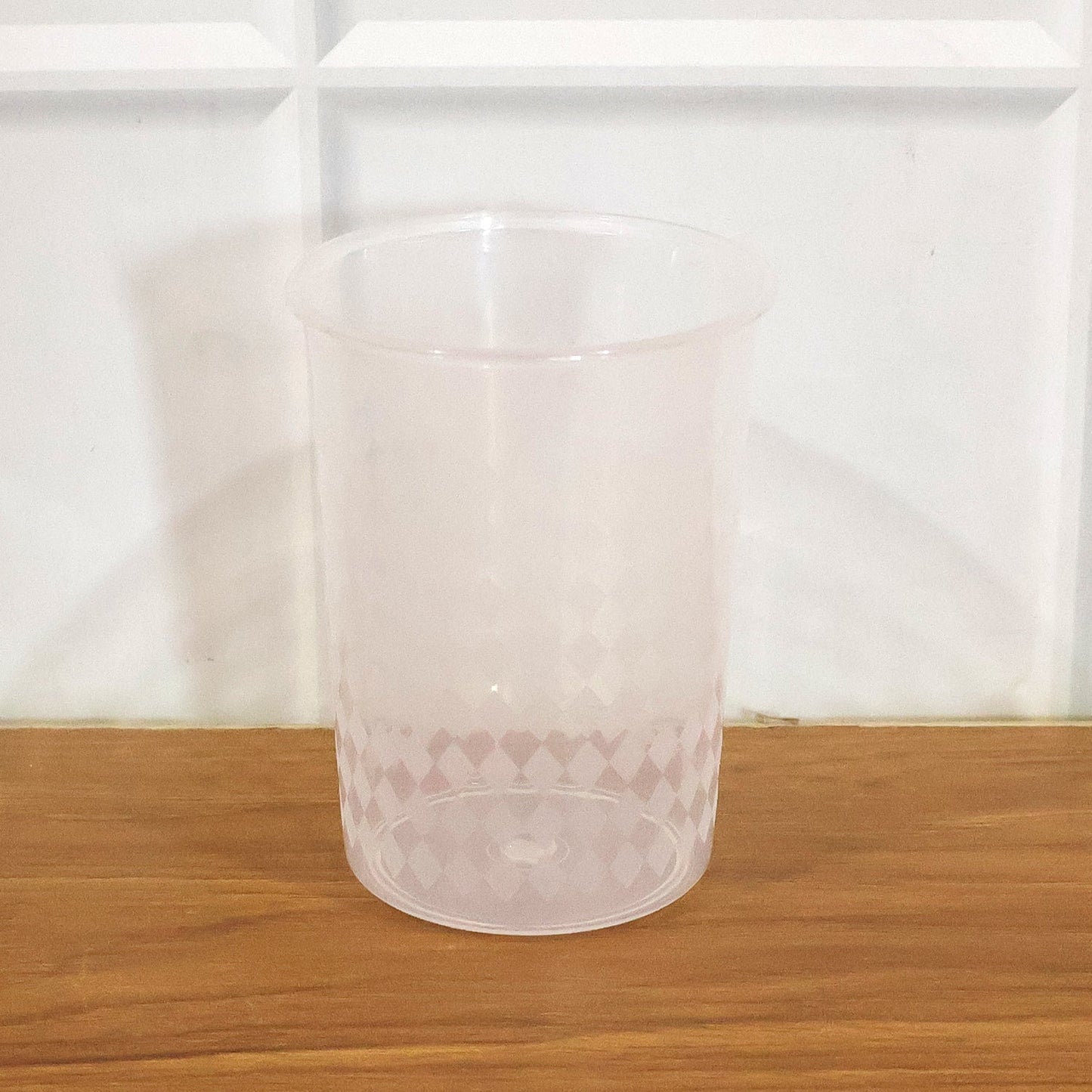 Side view of plastic drinking glass highlighting lightweight and sturdy build