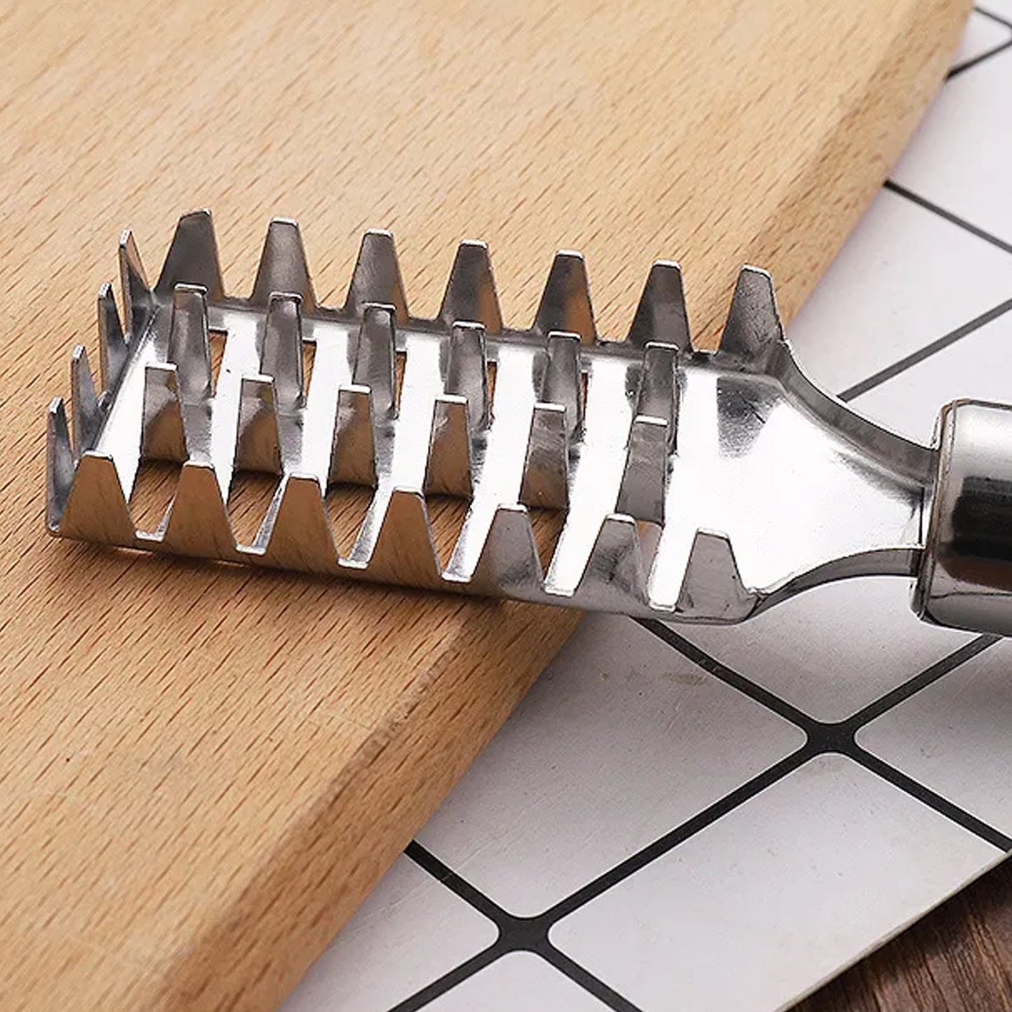 Ergonomic, non-slip handle design of the fish scale remover for comfortable grip.