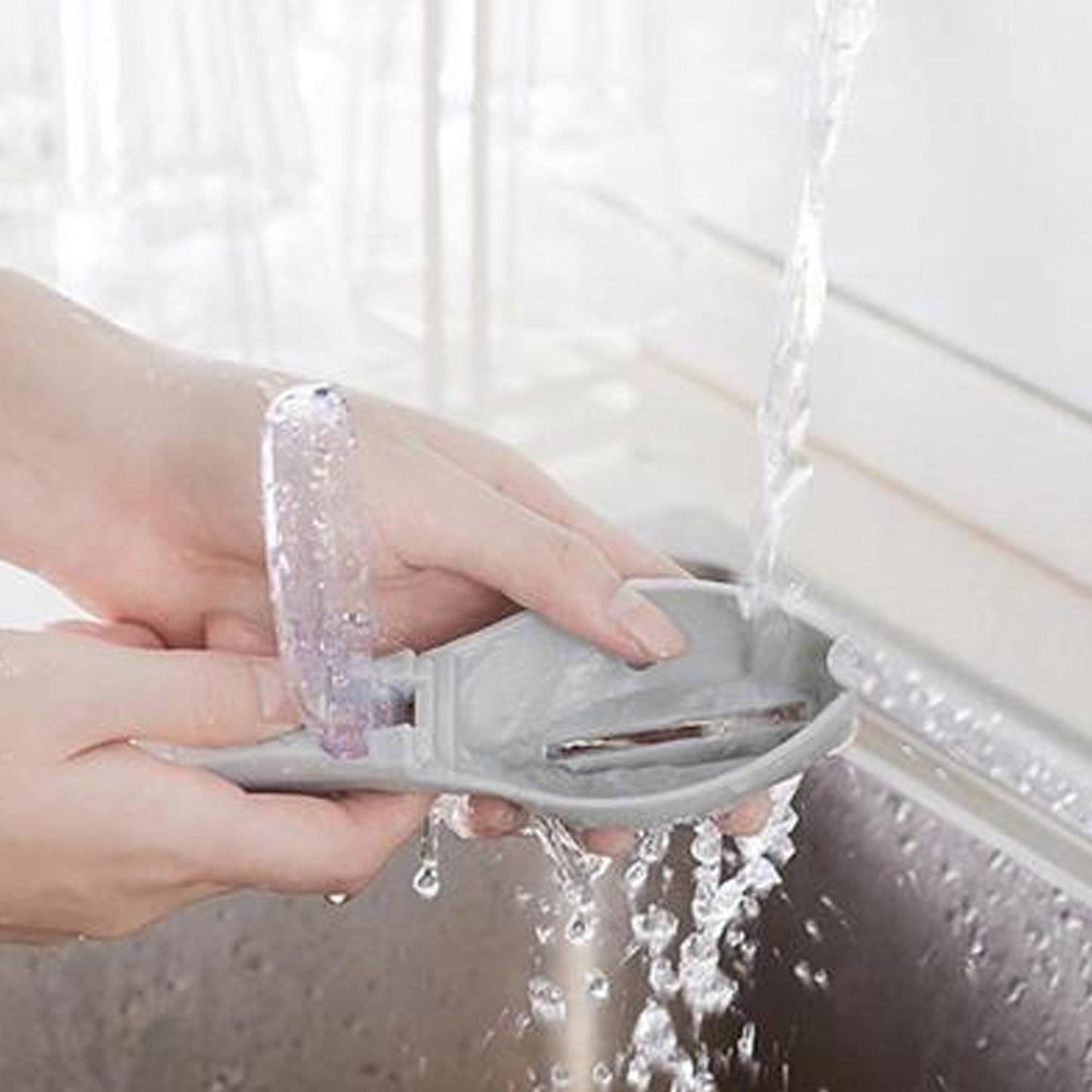 A modern kitchen tool, the Fish Scale Scraper, shown ready for use.