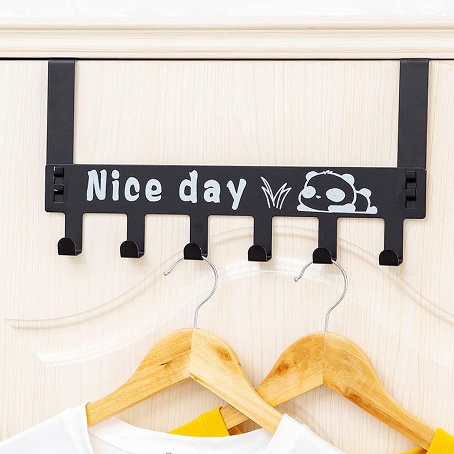 Panda over door hook rack organizing towels on a white door, showcasing practical use.
