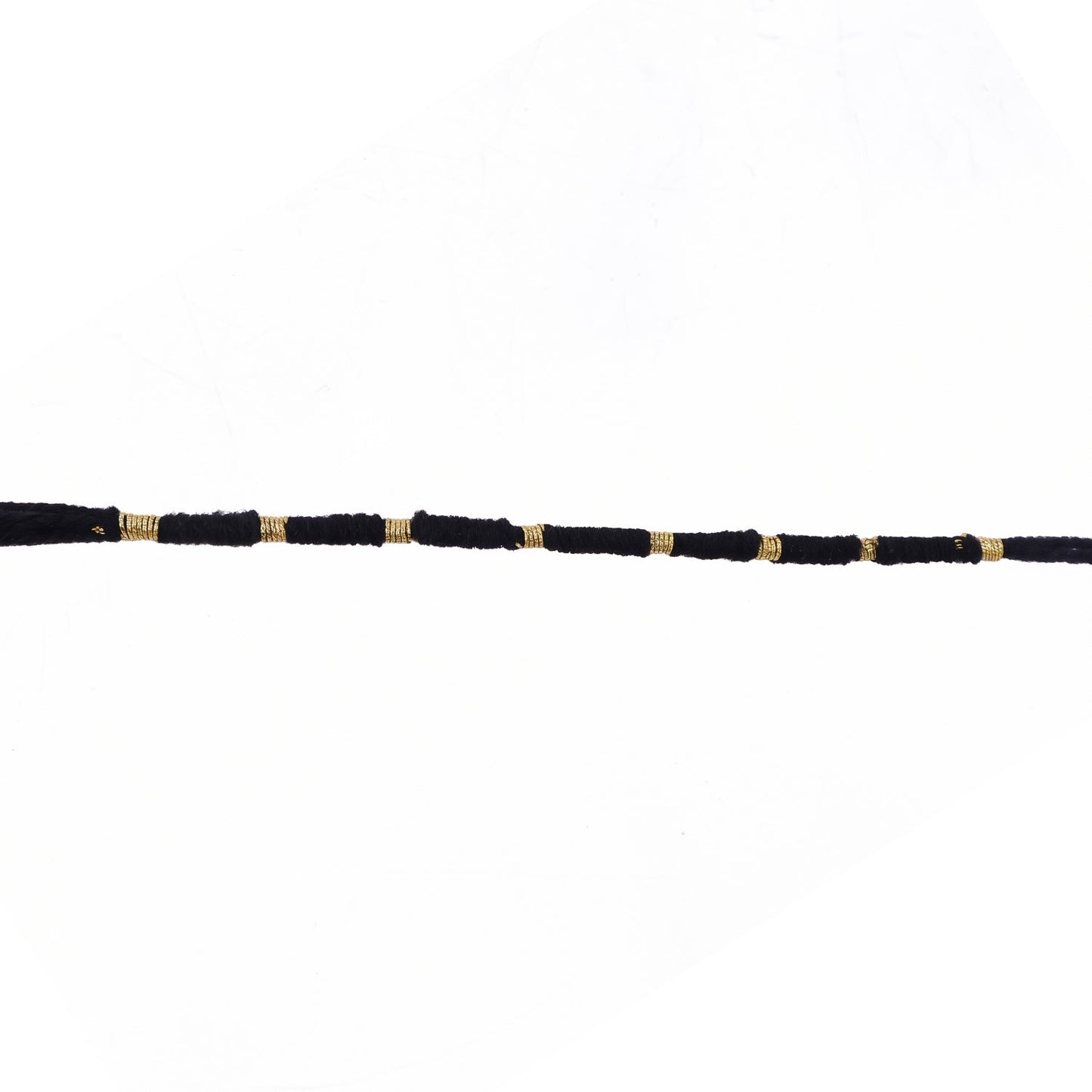 Red Mauli rakhi with gold and pearl details for festival