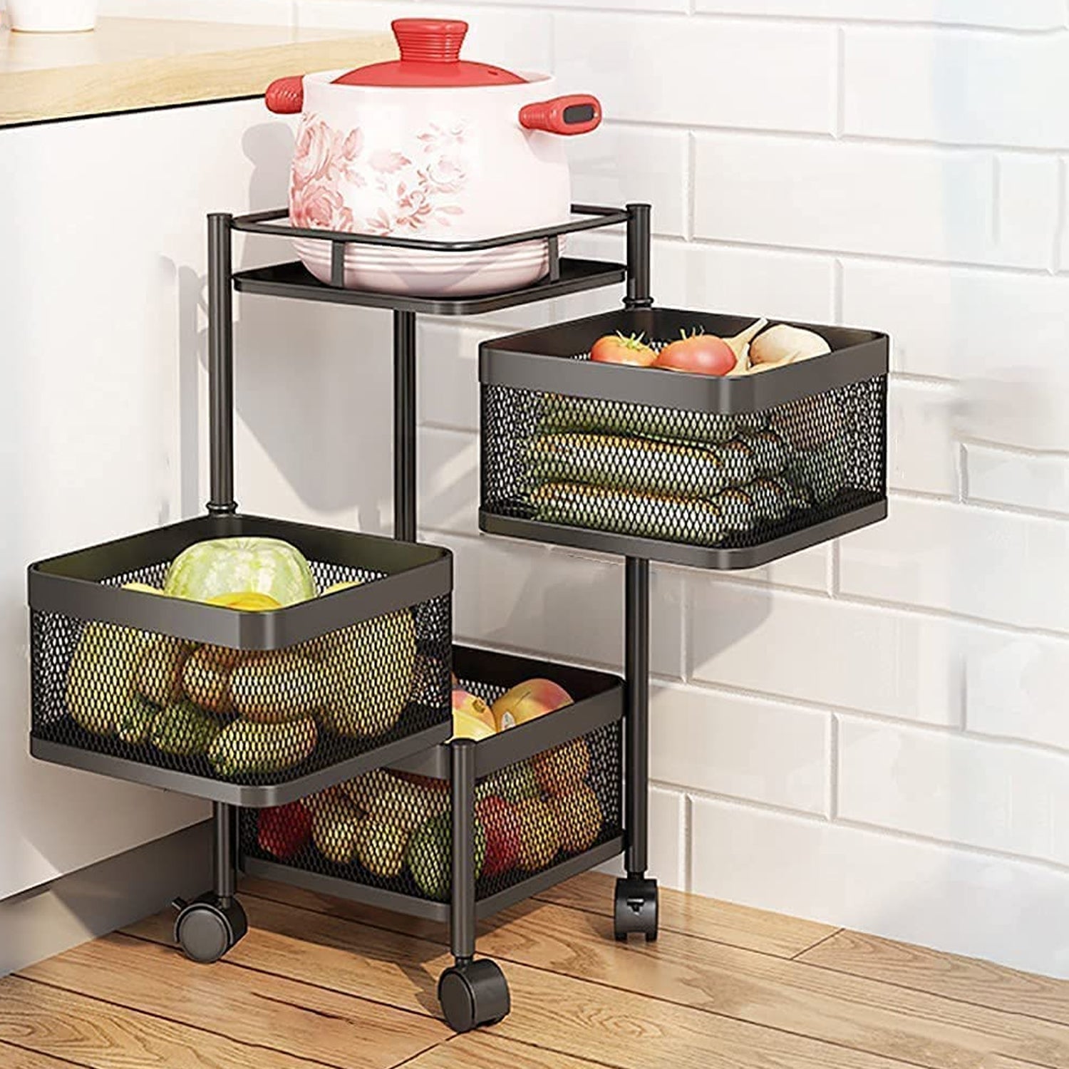 CookAura 3-layer metal kitchen trolley with rotating baskets for fruit storage.