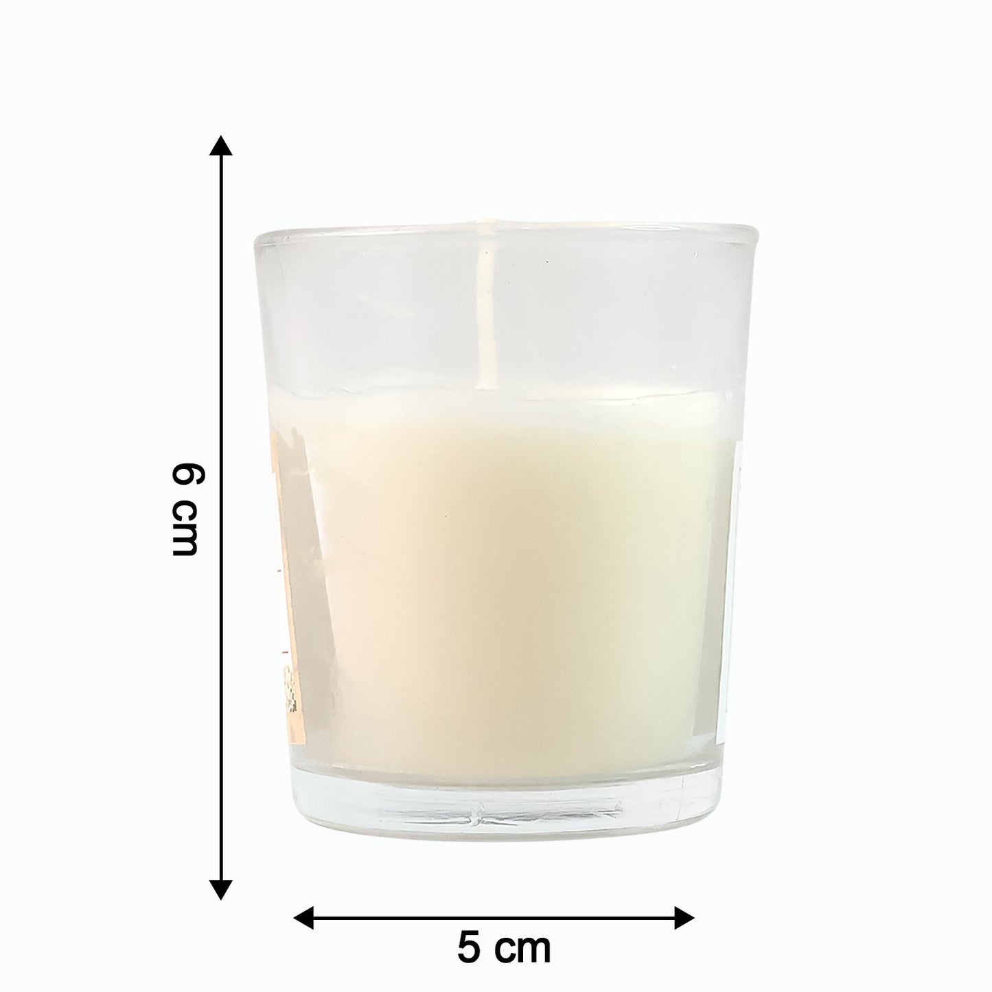 The Sweet Dreams Scented Votive Candle creating a serene ambiance on a bedside table.