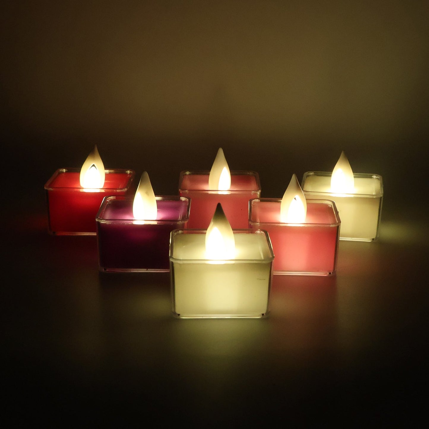 Decorative square LED tealight candles emitting flickering flame effect