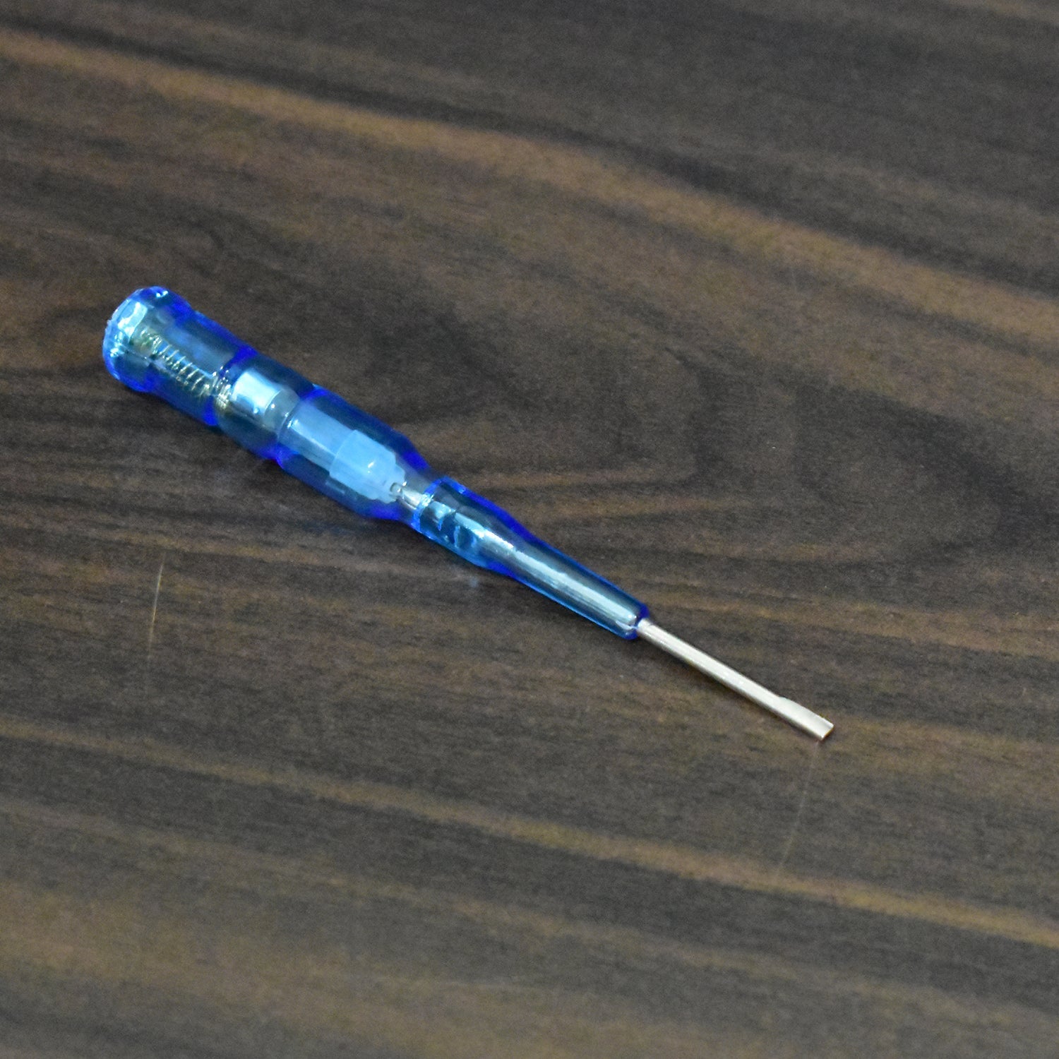 Durable metal screwdriver with a built-in voltage tester for various electrical applications.