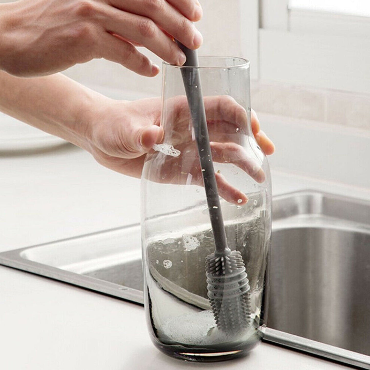 Multipurpose bottle cleaning brush with ergonomic handle for kitchen use.