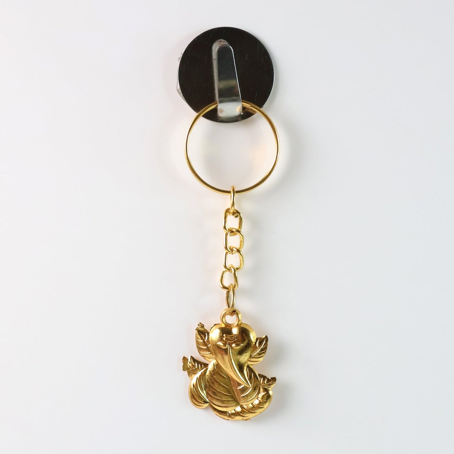 Side angle of Ganesh Leaf design keychain in golden metal