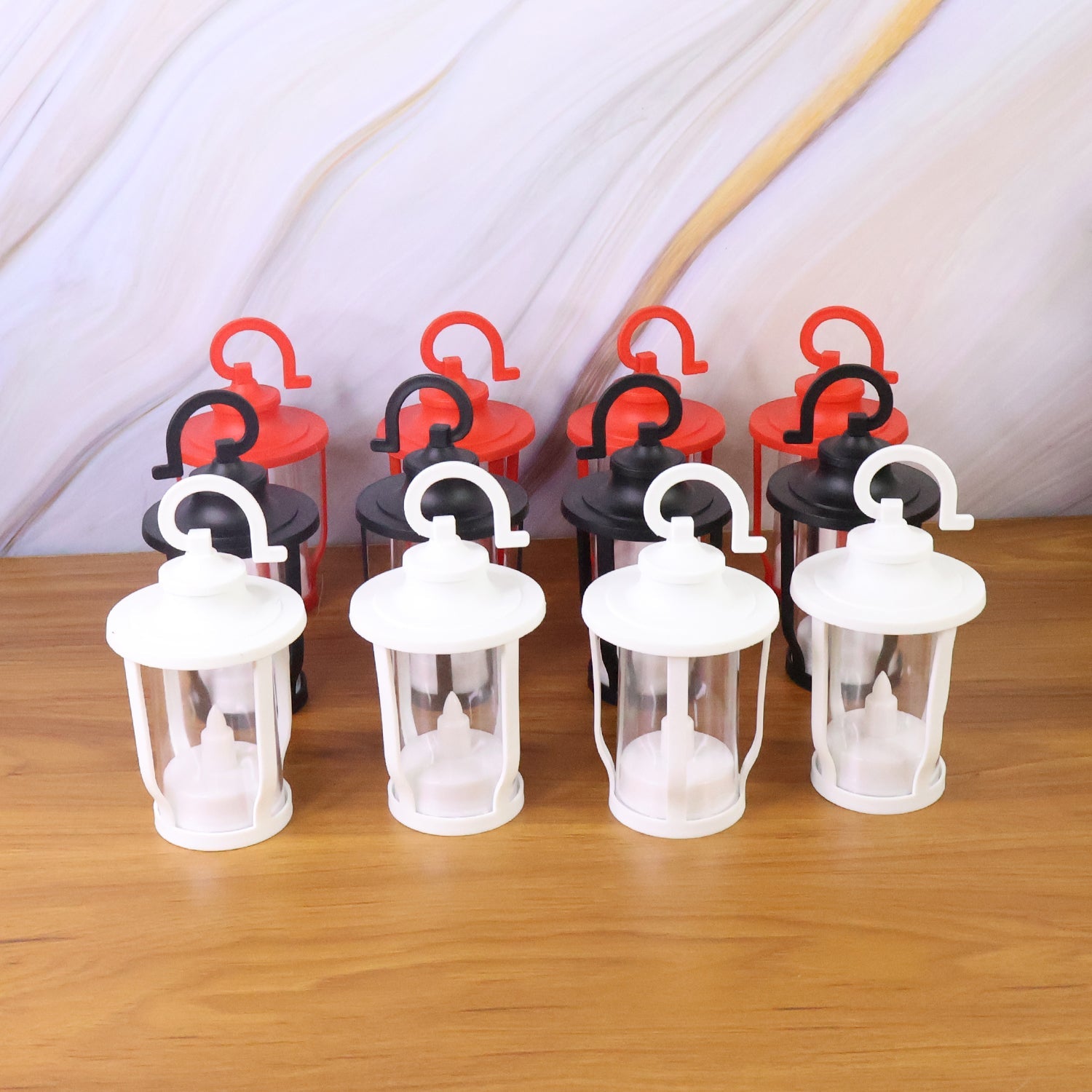 Lantern style flameless LED candles placed on bedside table for cozy lighting