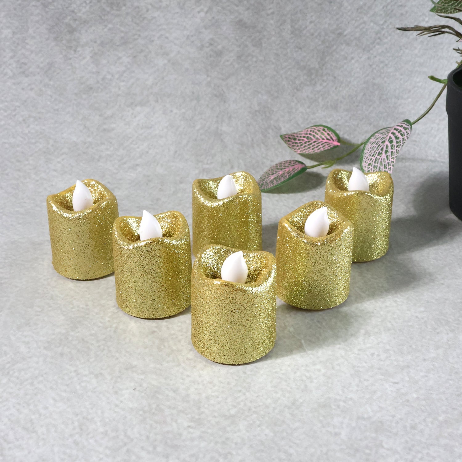 Close-up view of LED tealight candle with glitter and natural flicker effect