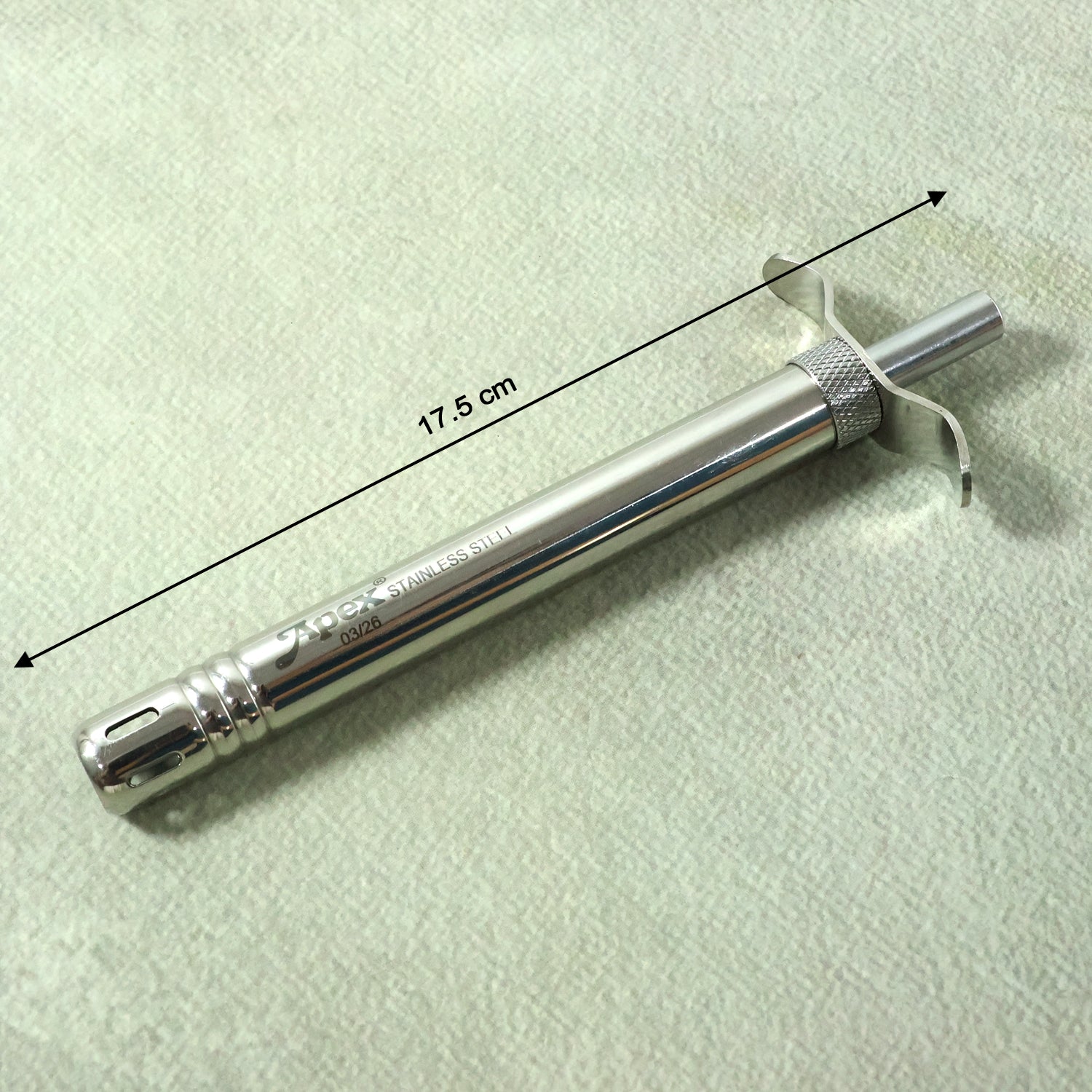 Stainless steel manual gas stove spark lighter showing ignition tip