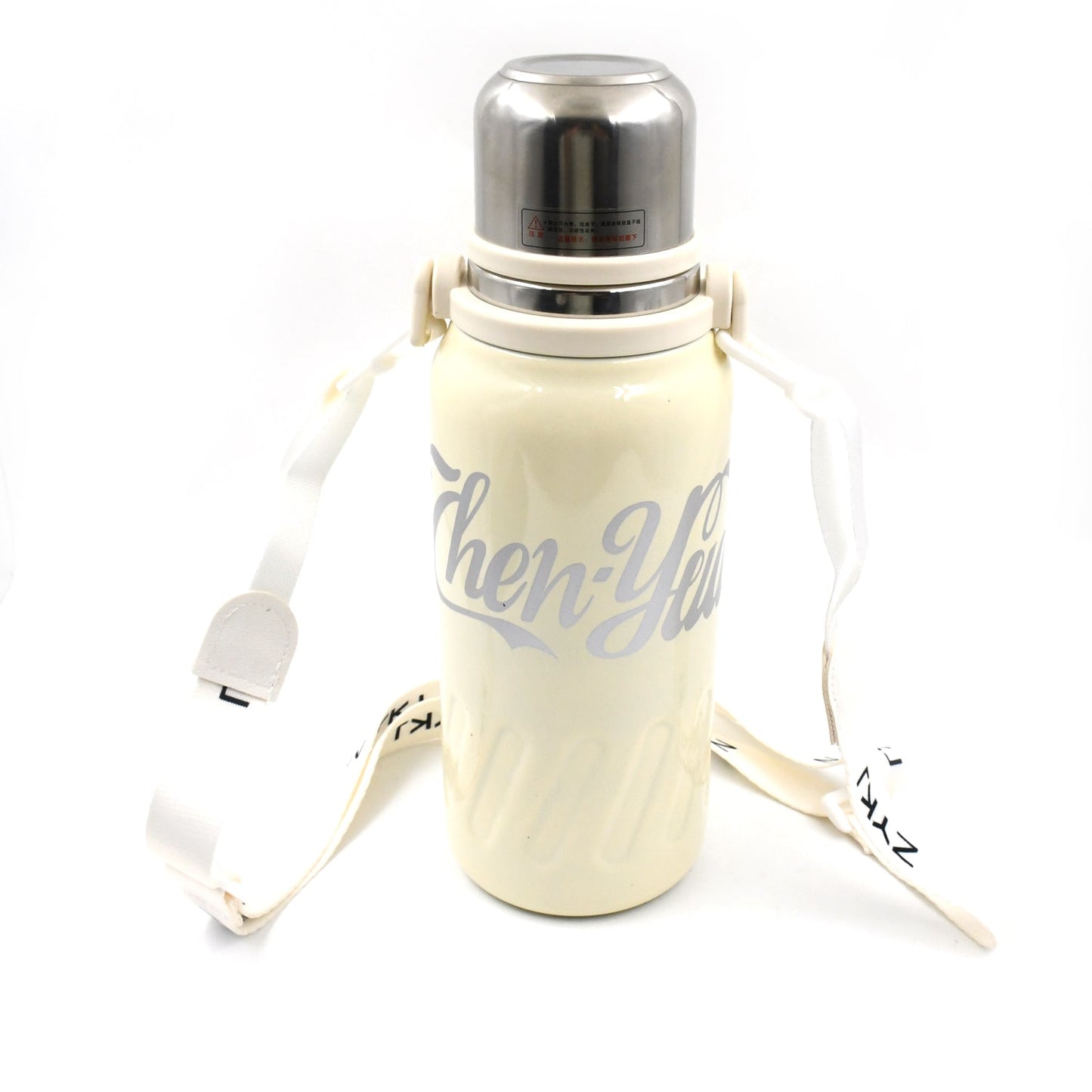 The 1200ML hot and cold water bottle being carried comfortably by its handle.