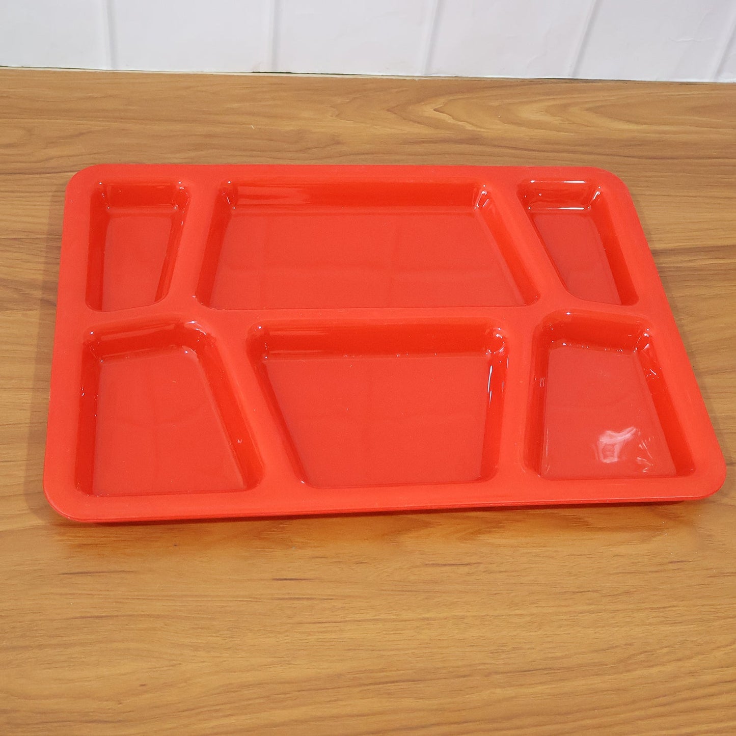 Multi-section plastic serving tray with smooth surface for quick washing