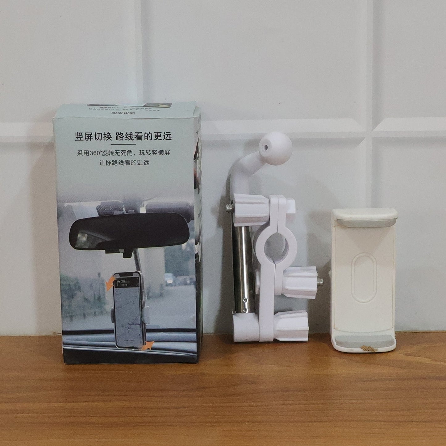 Rotating car phone holder demonstrating flexible 360 degree movement