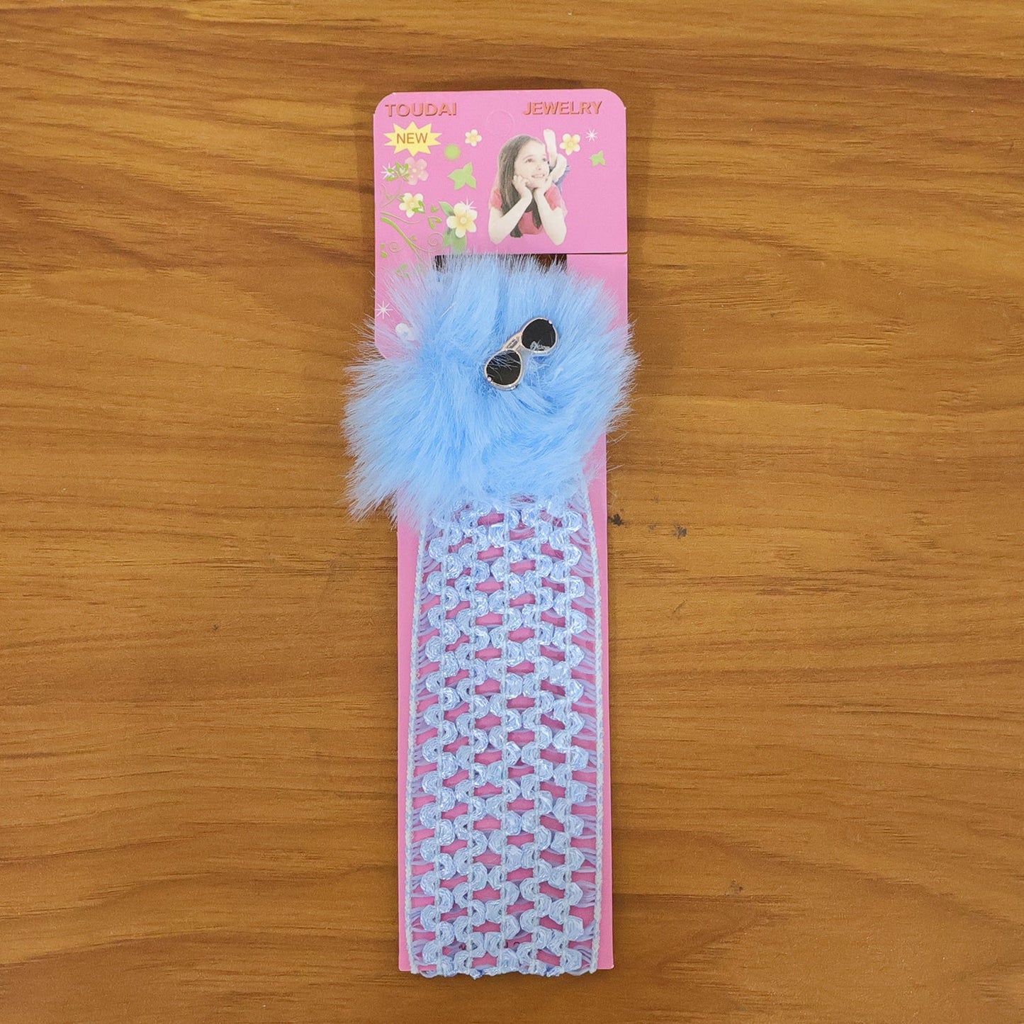 Stylish baby girl headband with cute pom pom design