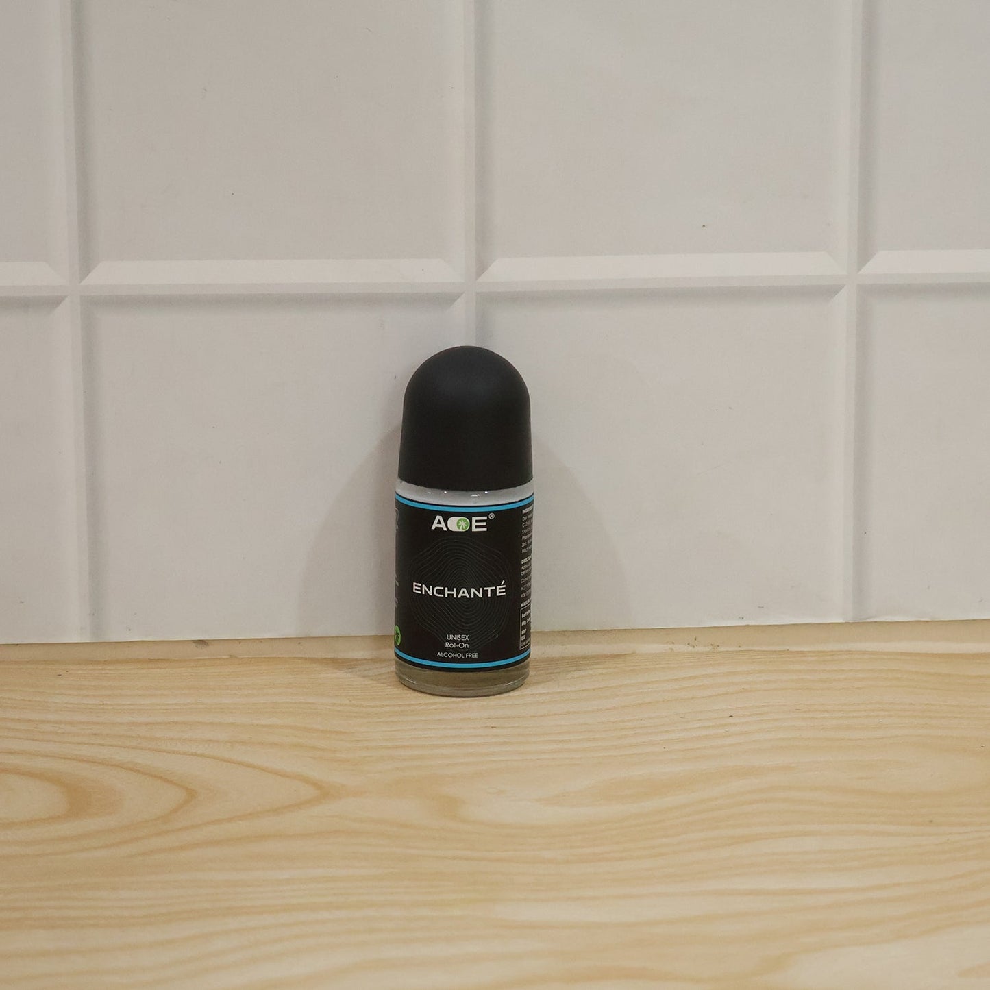 Blue AOE roll-on deodorant with label and cap attached