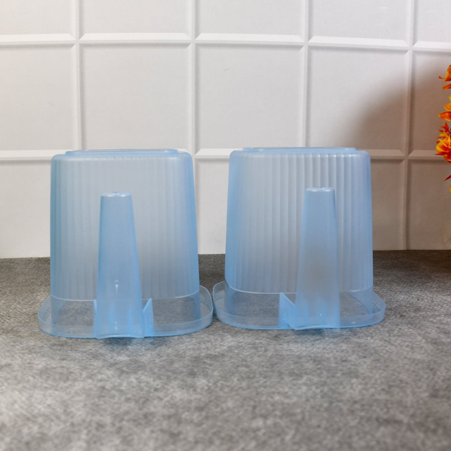 Four vibrant 1000 ML plastic bath mugs arranged neatly, ready for everyday home use.