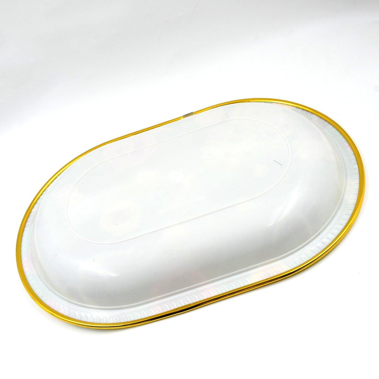 Multiple plastic serving trays stacked, highlighting their compact storage.