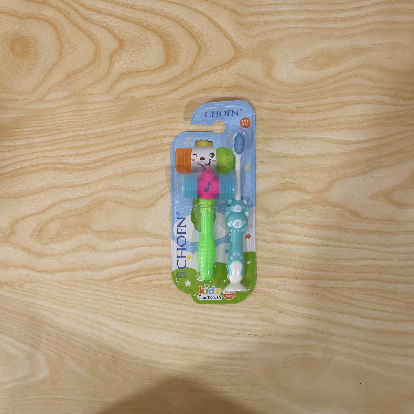 Variety of kids' toothbrush and hammer toy sets arranged