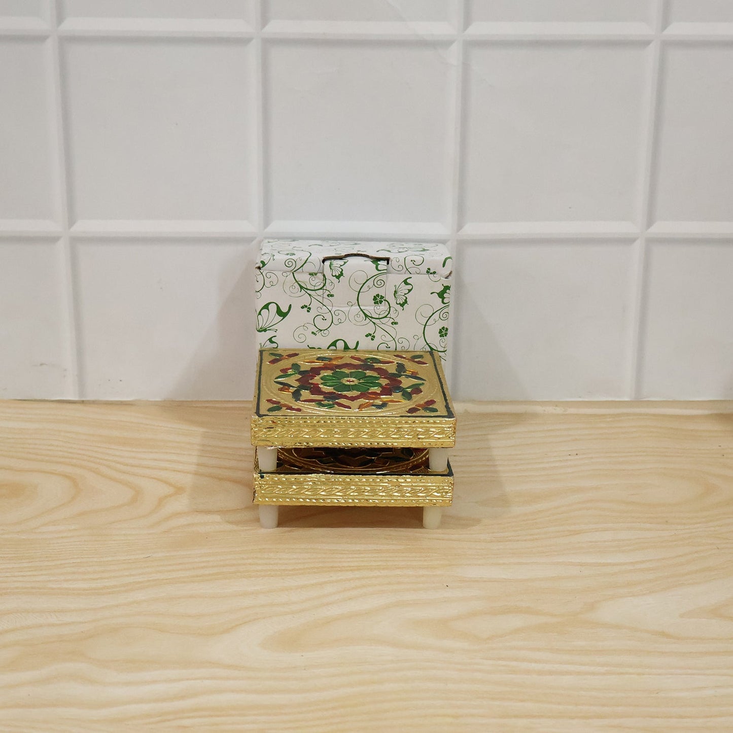 Another style of wooden chowki featuring a geometric pattern and vibrant colours, suitable for home decor.