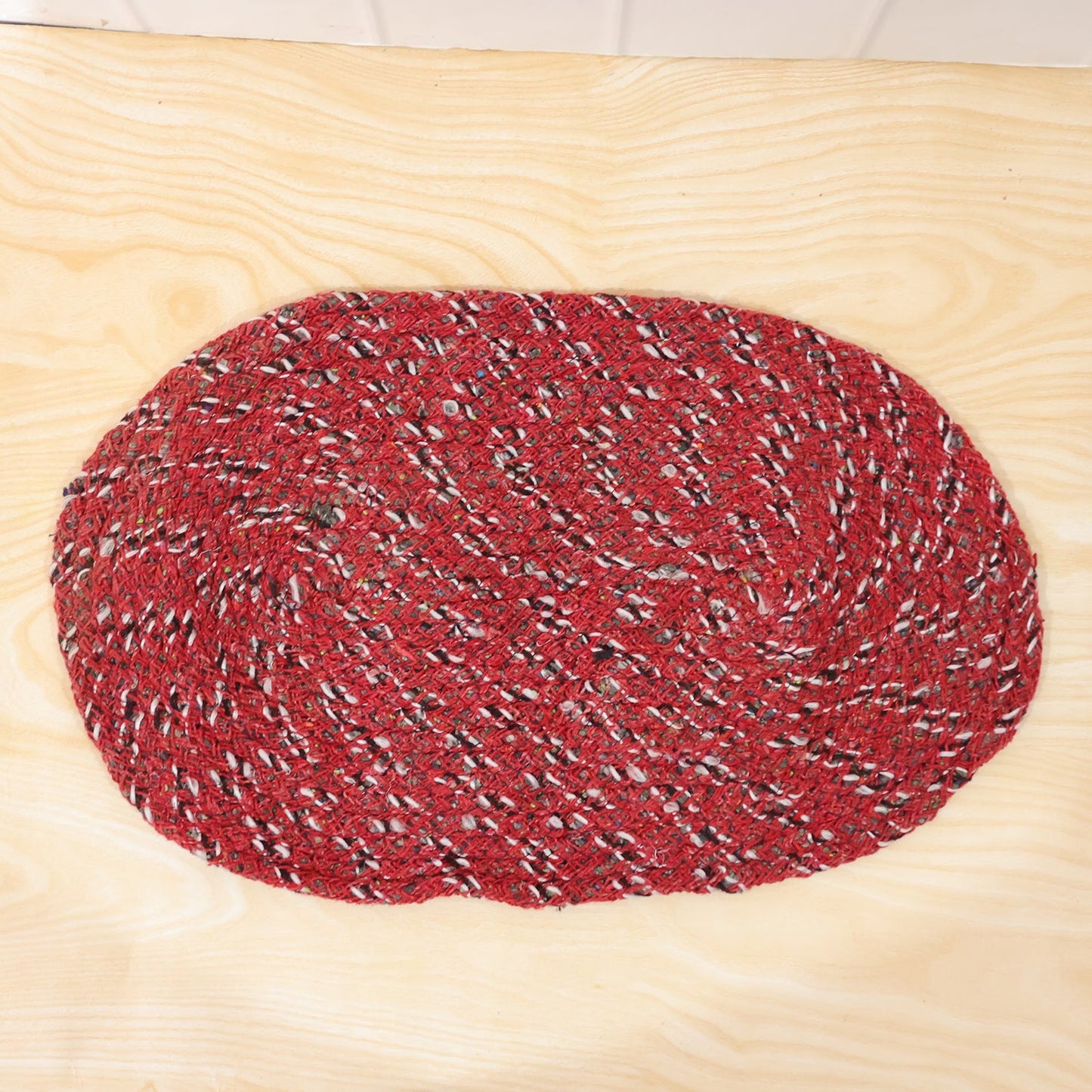 Detail shot of textured red floor mat for indoor use