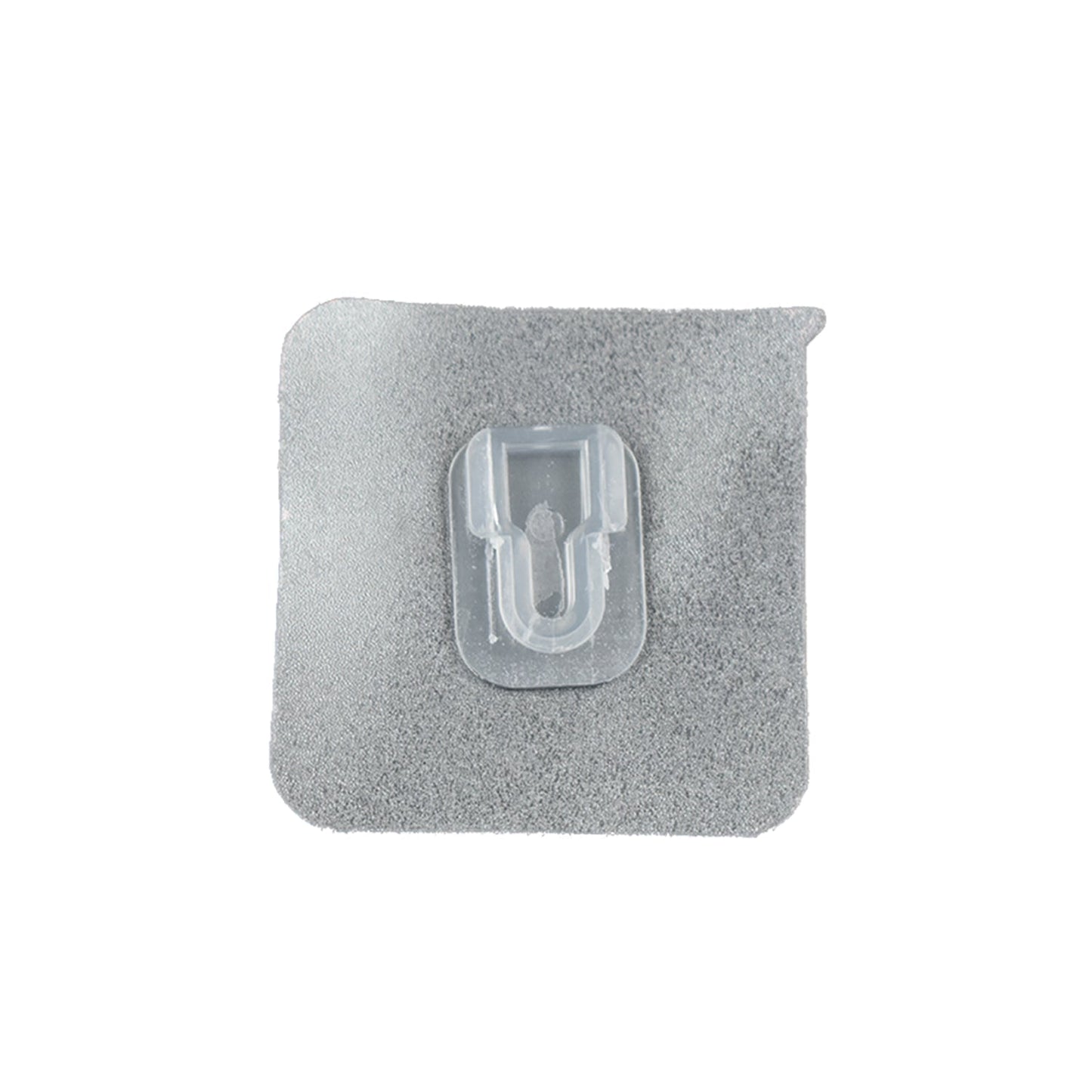 GlimmerHome transparent adhesive hook discreetly blending into a white wall.