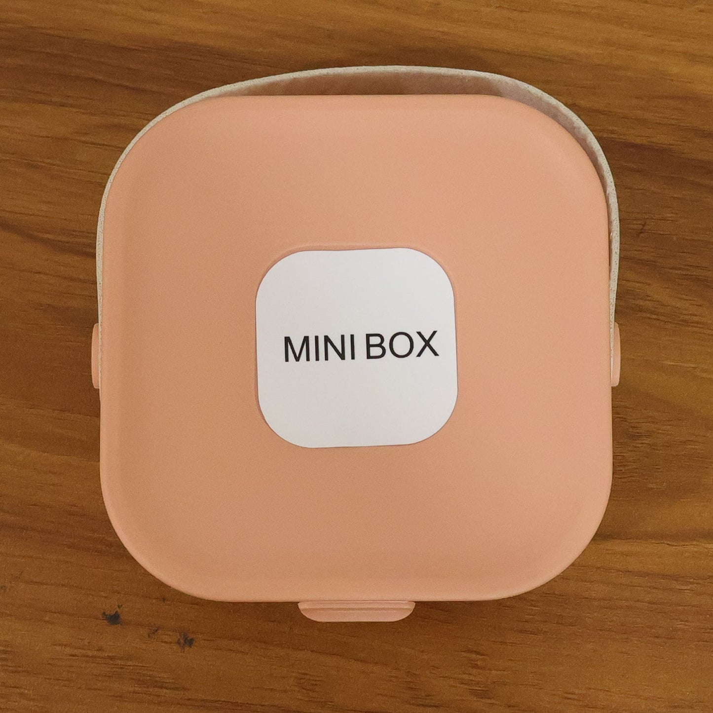 Back view of travel-friendly mini jewelry storage box with built-in mirror