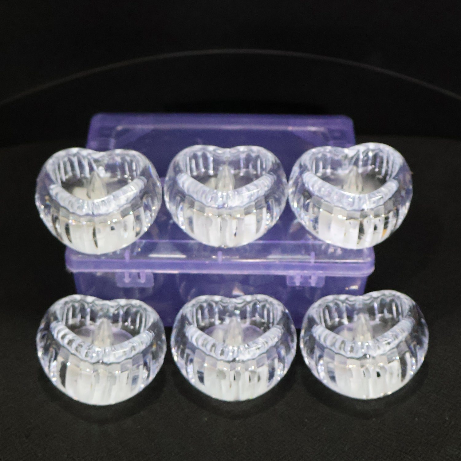 Battery powered LED crystal tealight candles set illuminating room
