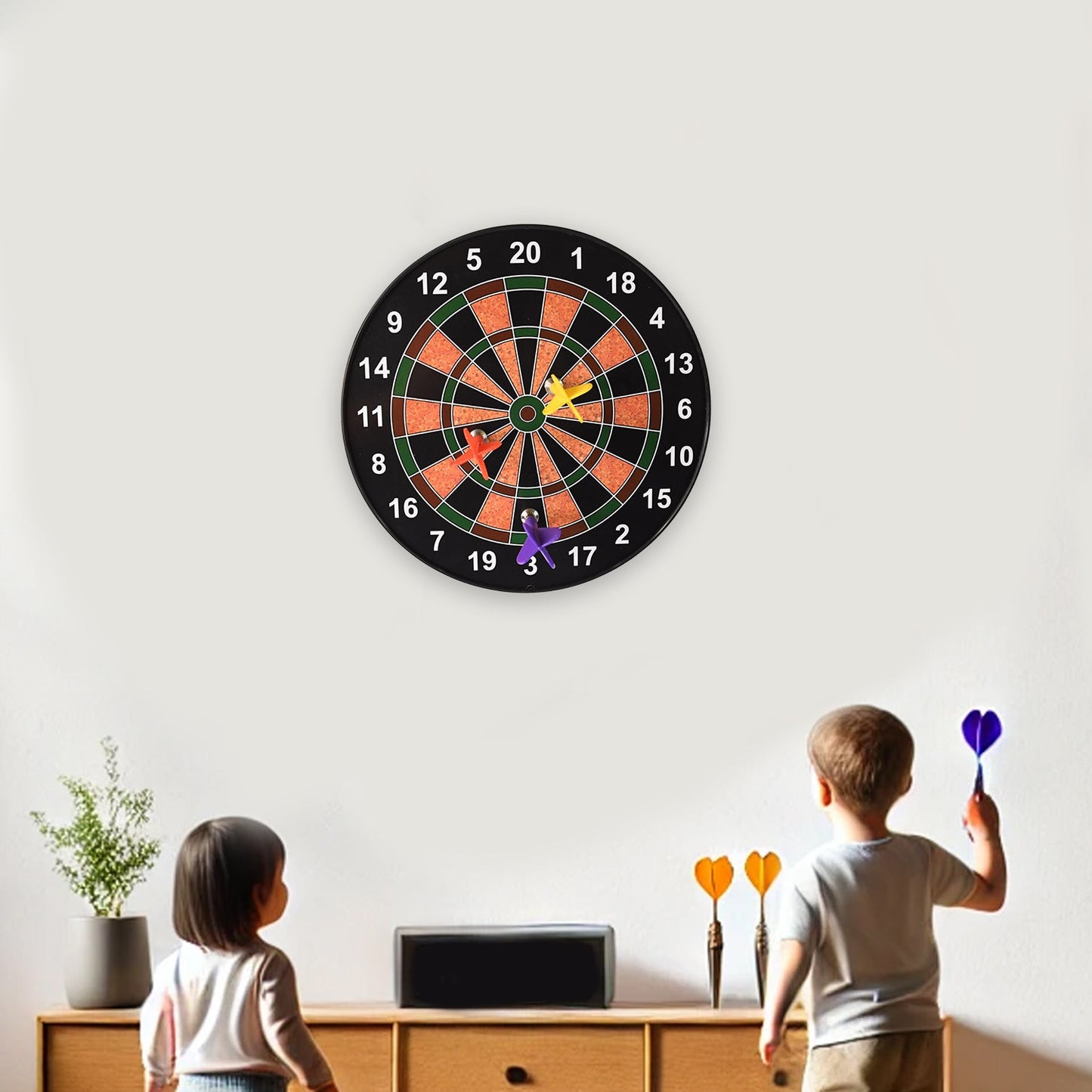 Contents of the magnetic dartboard game set box including board and darts