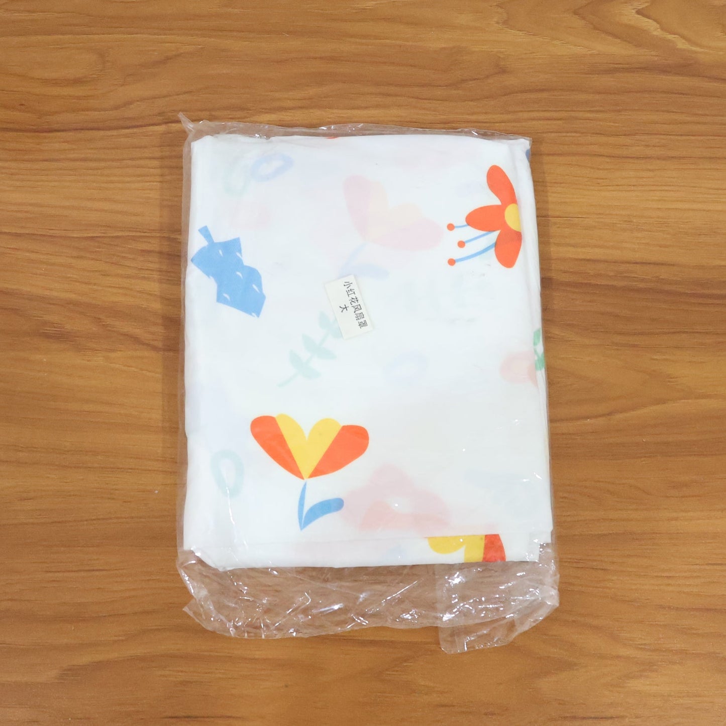 Folded flower-printed fan cover showing vibrant colors