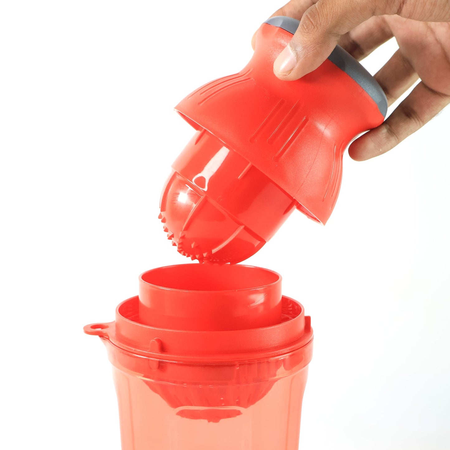 Side view of manual juicer handheld for portable use
