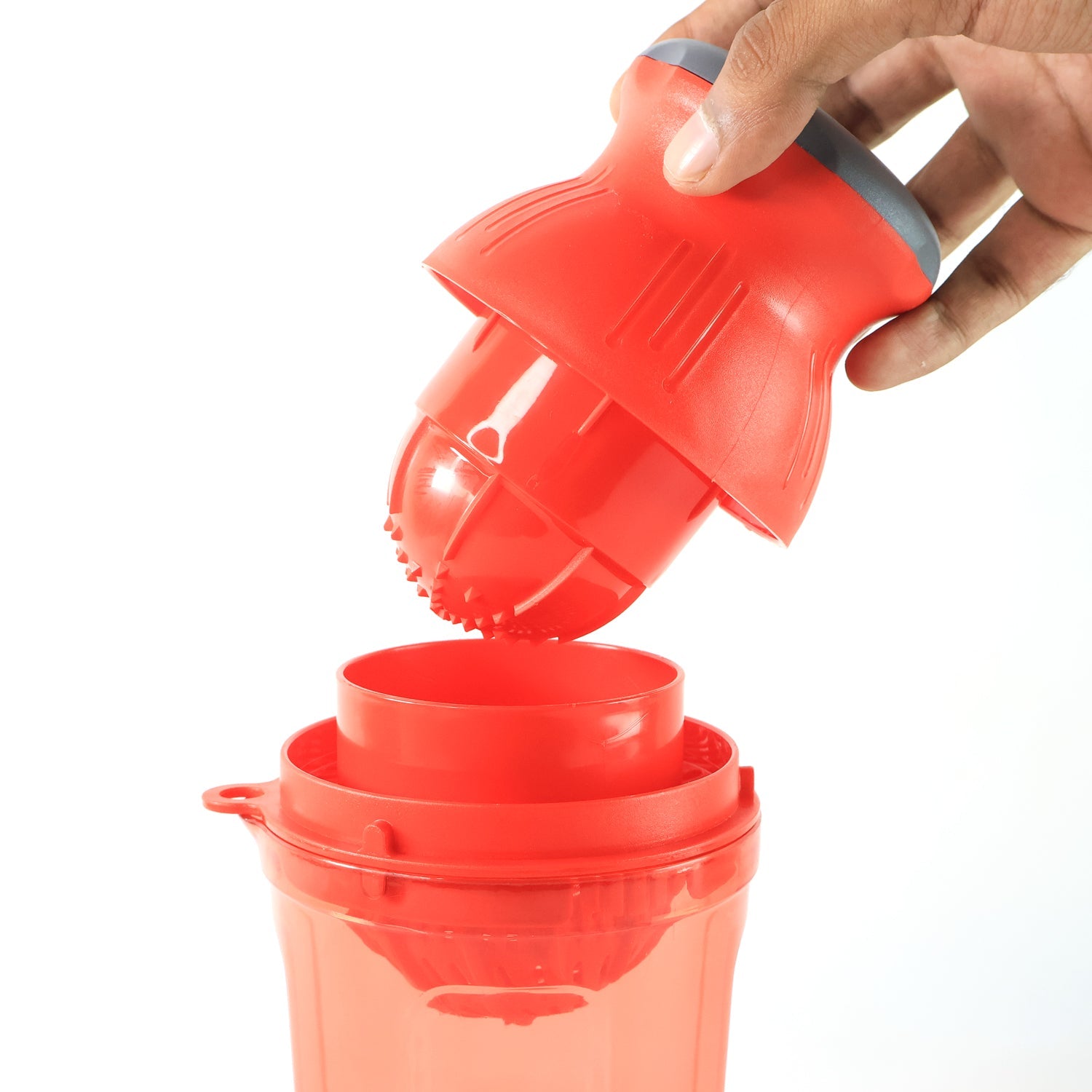 Side view of manual juicer handheld for portable use