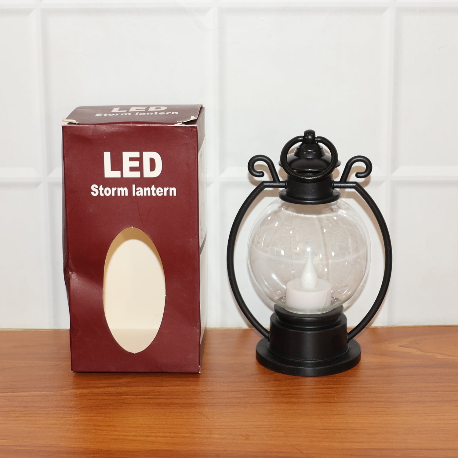 Classic round globe LED storm lantern providing cozy ambient light