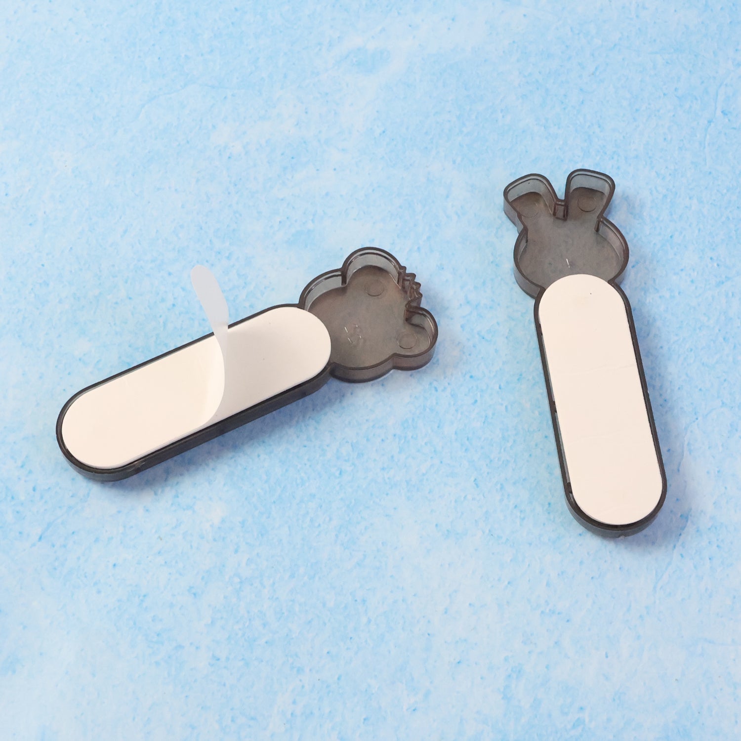 Adhesive push pull door handle mounted on cabinet door