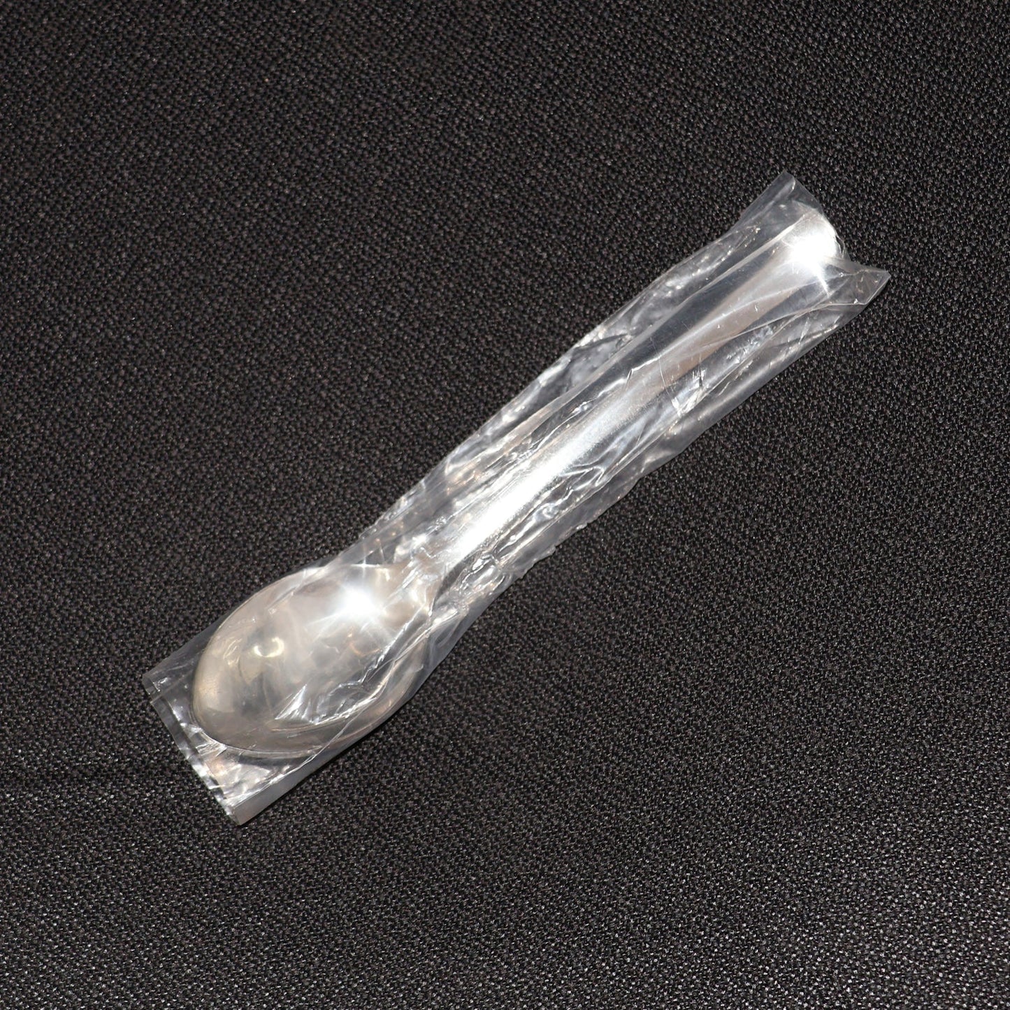 Stainless Steel Dining Spoon alongside other cutlery, ideal for home or café use.