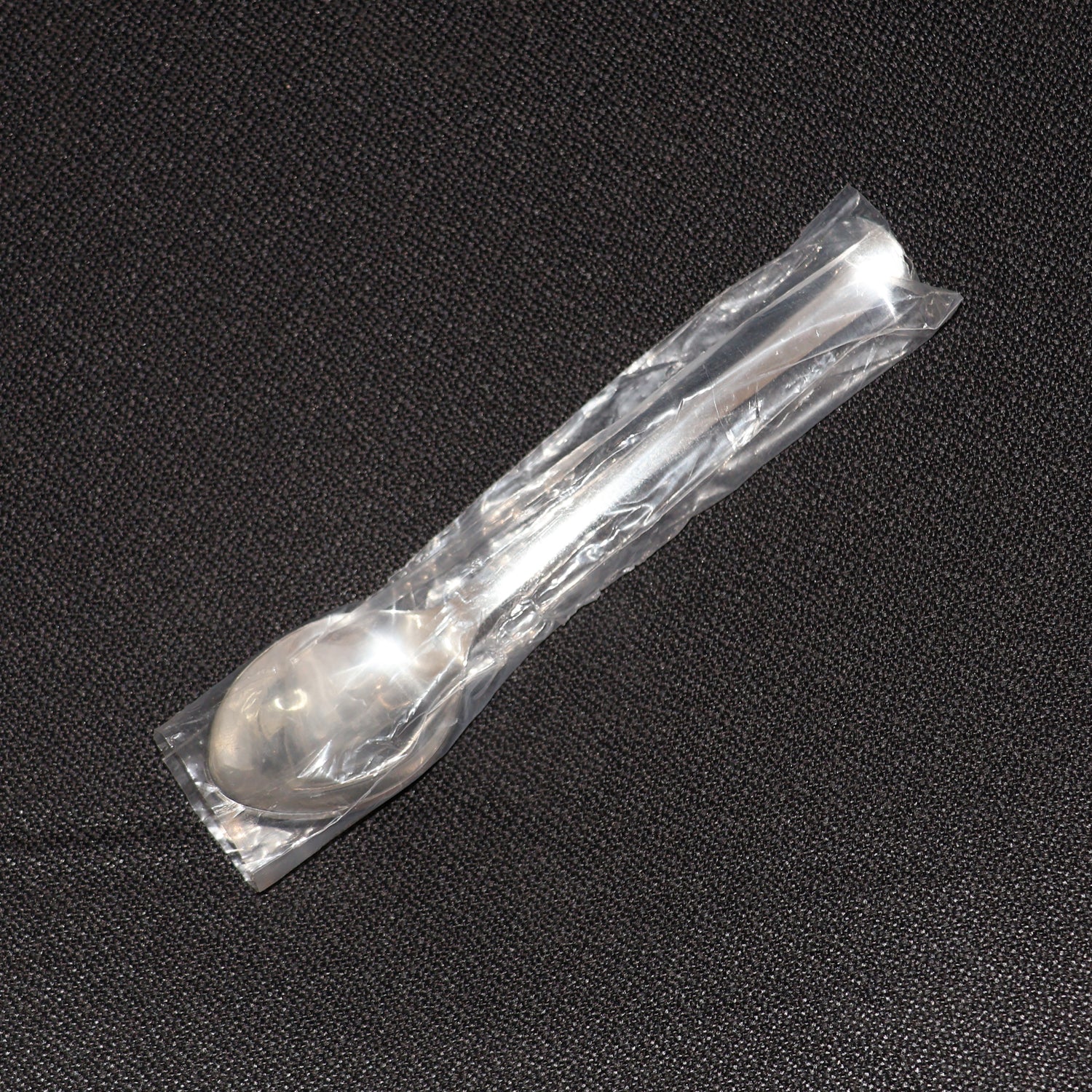 Stainless Steel Dining Spoon alongside other cutlery, ideal for home or café use.