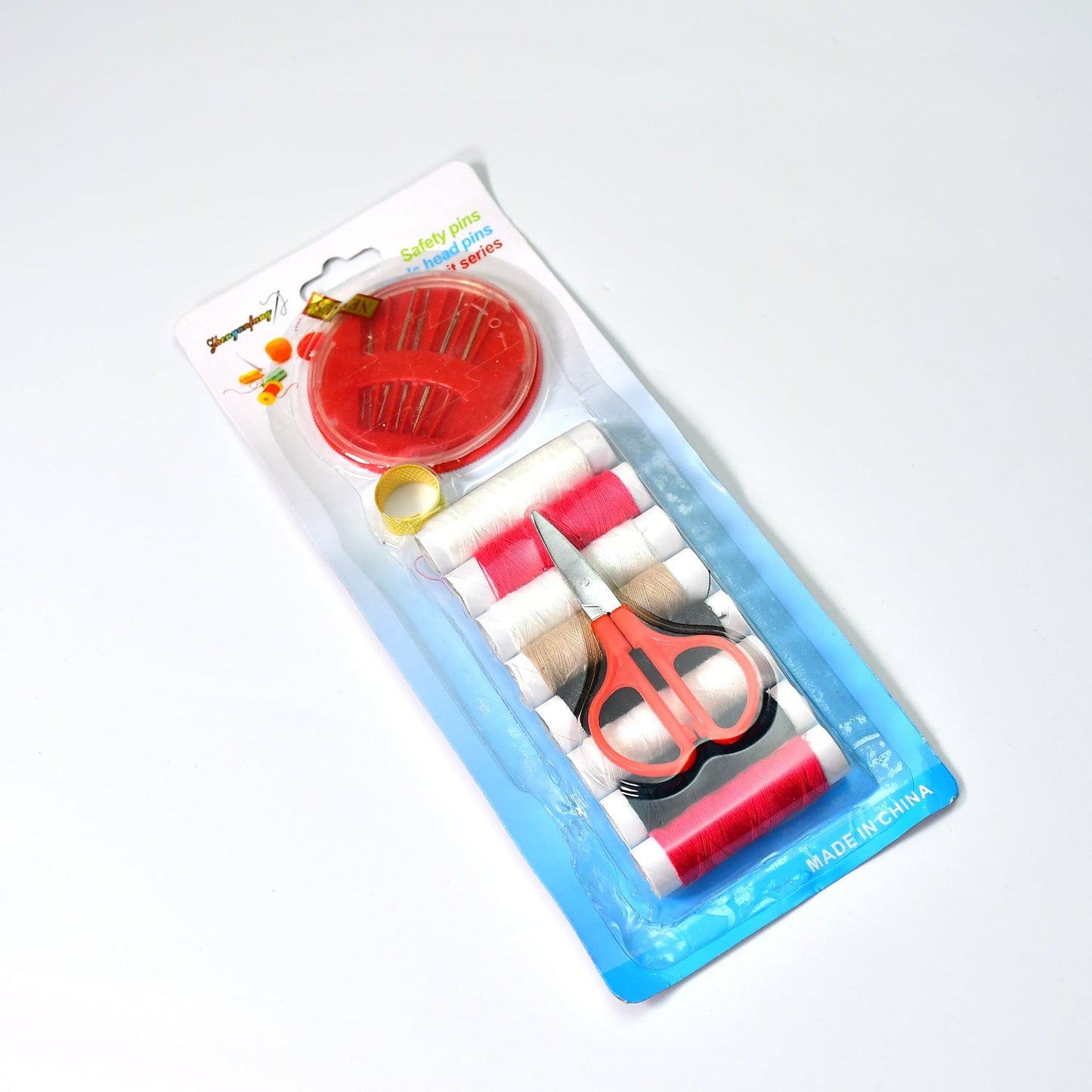 Organized sewing kit with thread, needles, and measurement tape for home use.