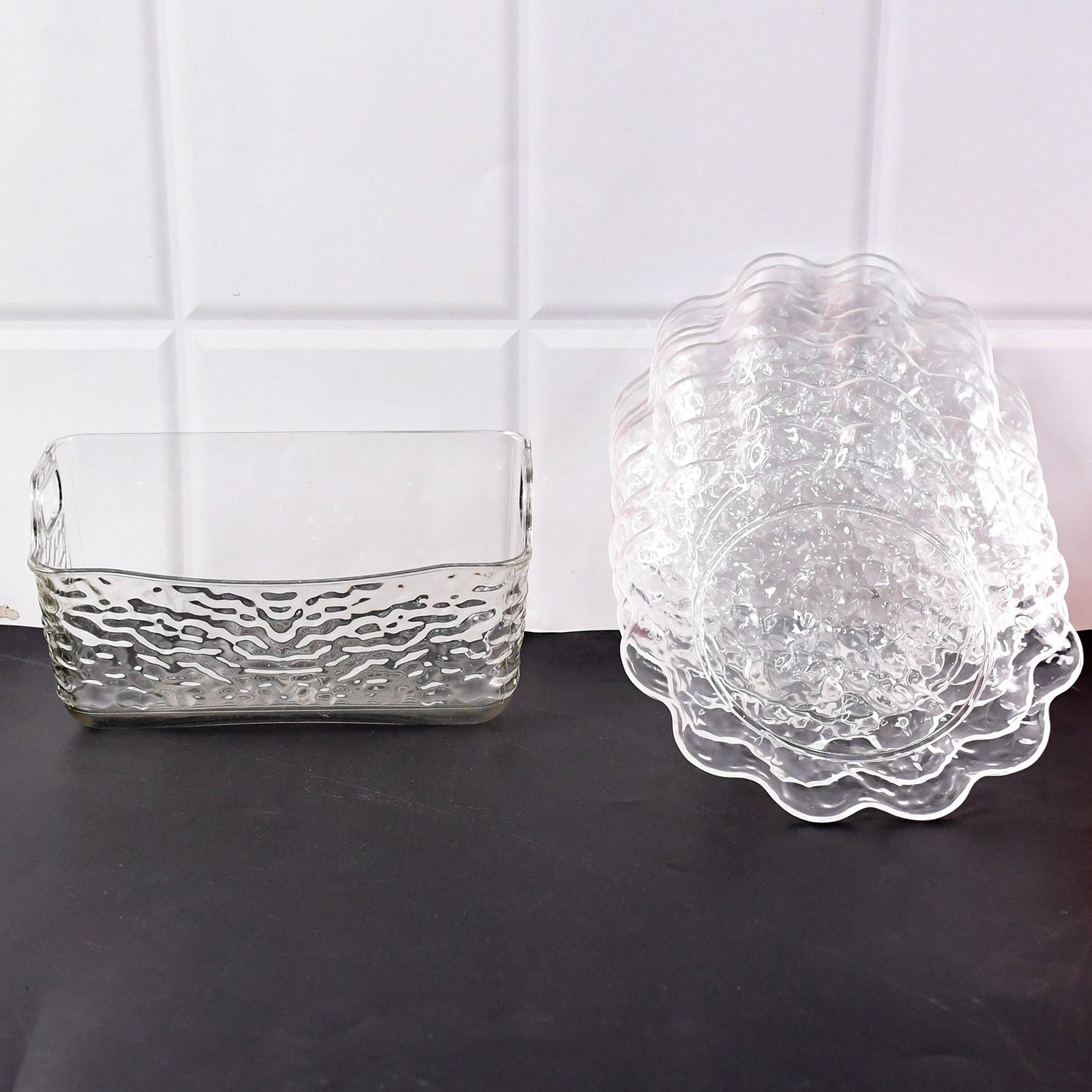 Elegant plastic bowls with textured finish arranged on serving tray