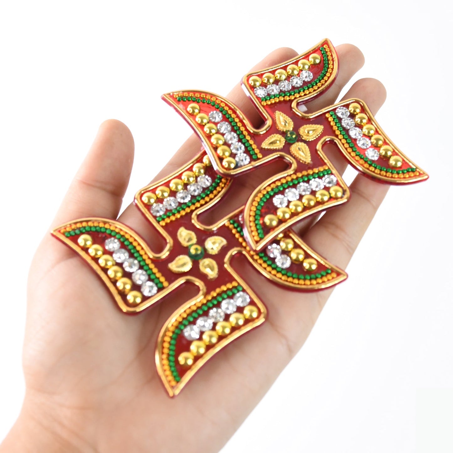 Swastik symbol sticker highlighted with red-orange and gold detailing