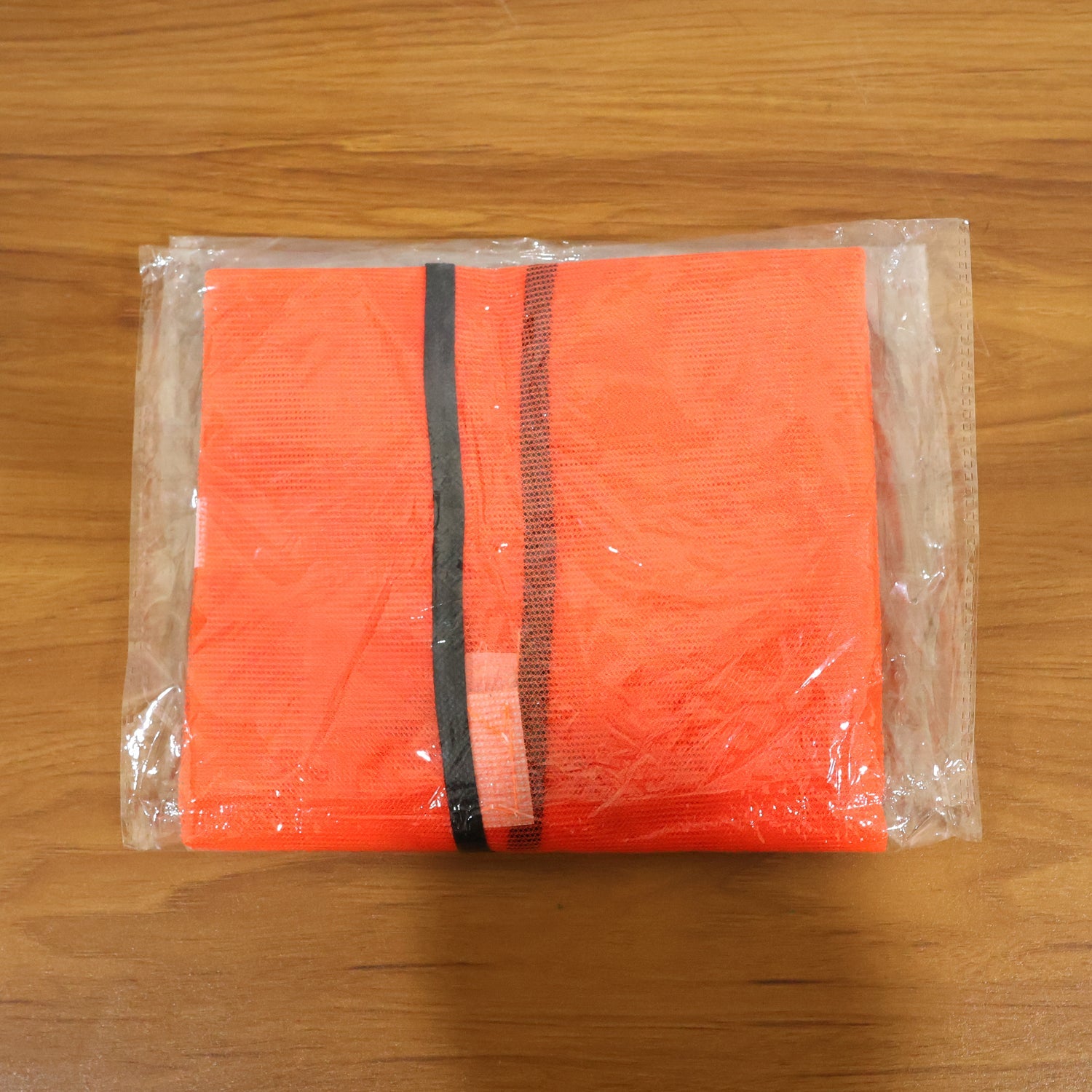 Detailed view of the reflective strips on the Orange Safety Jacket, ensuring maximum nighttime visibility.