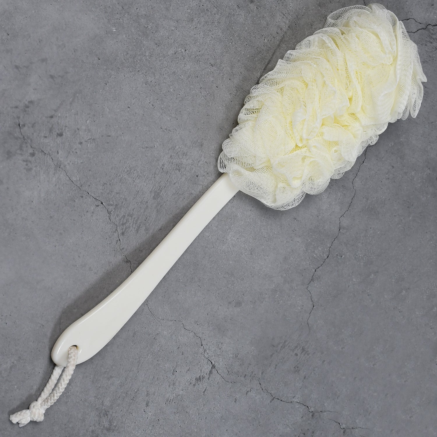 The loofah back scrubber positioned for an effective shower routine.