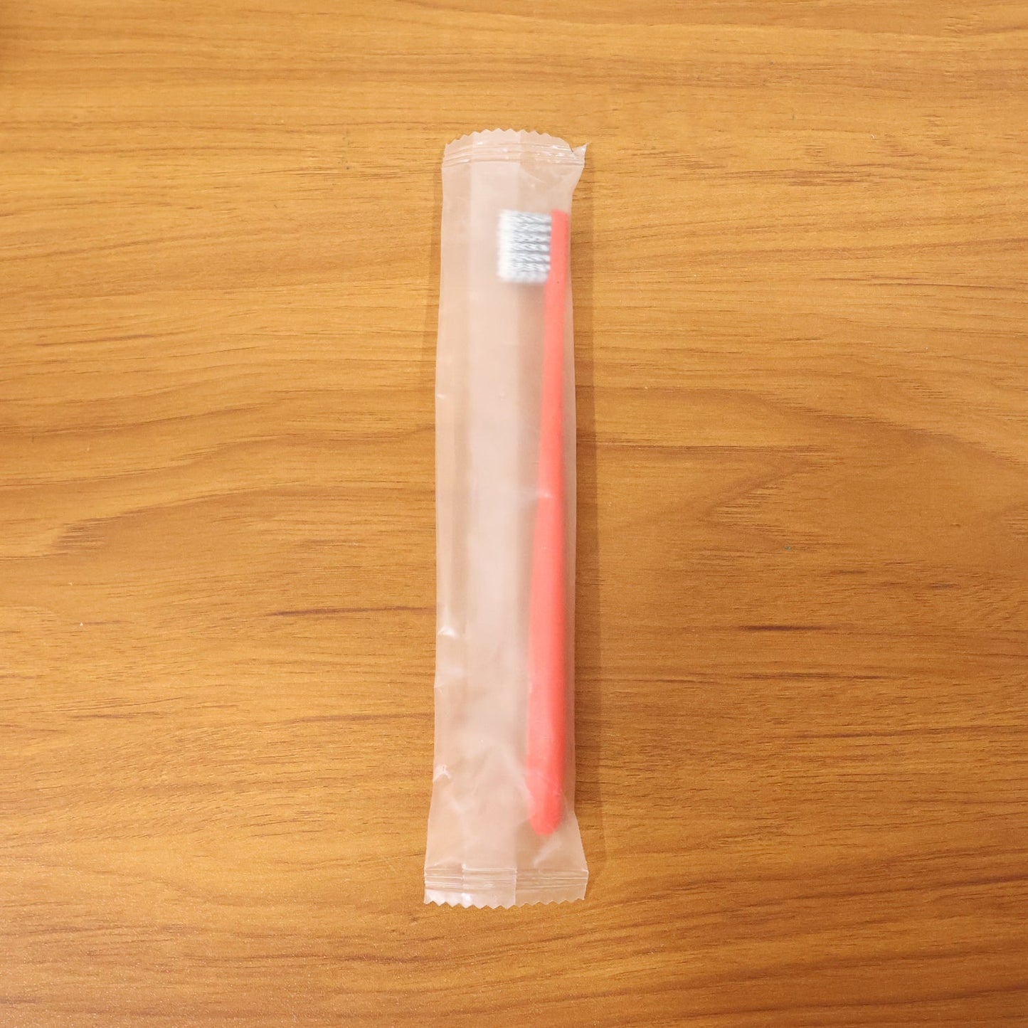 Child-friendly soft bristle toothbrush with ergonomic handle