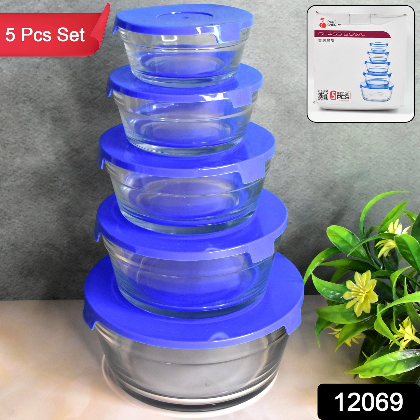 Stackable glass bowls with matching lids, showcasing various sizes for storage.