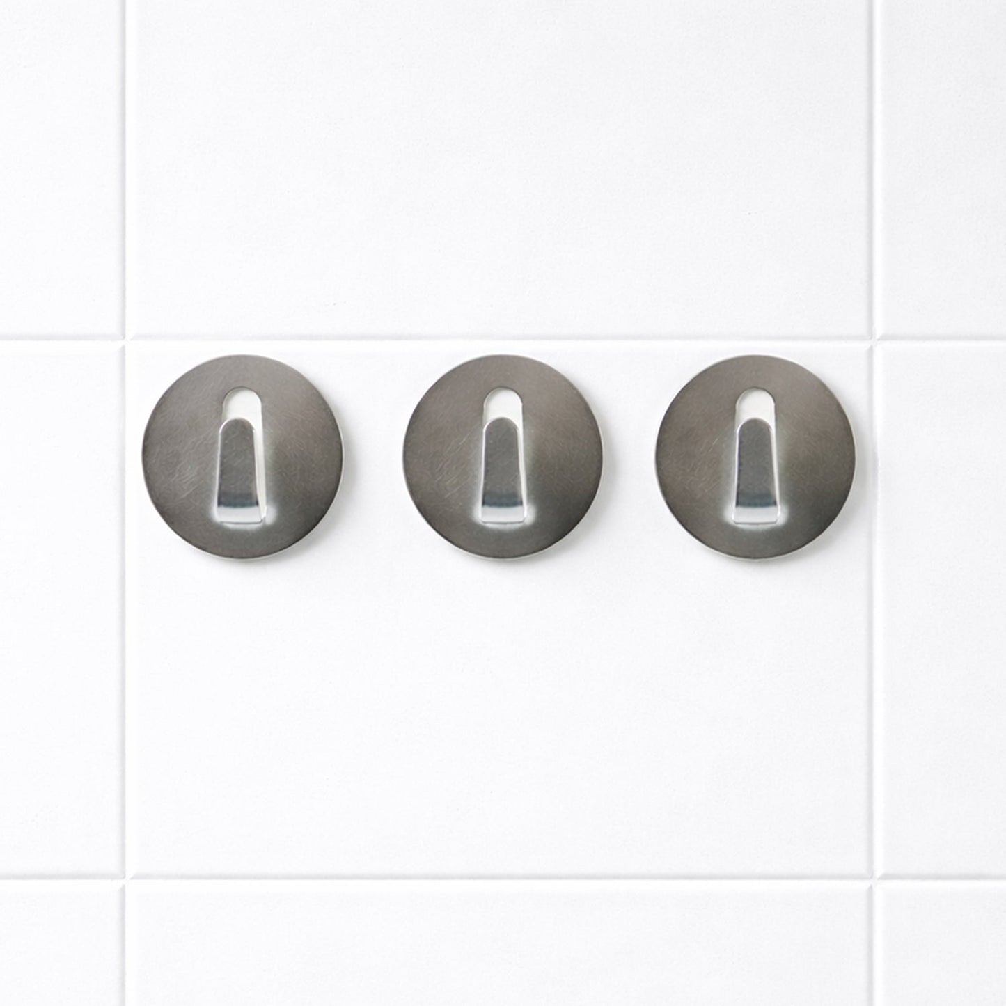Set of reusable stainless steel hooks with a shiny silver finish.