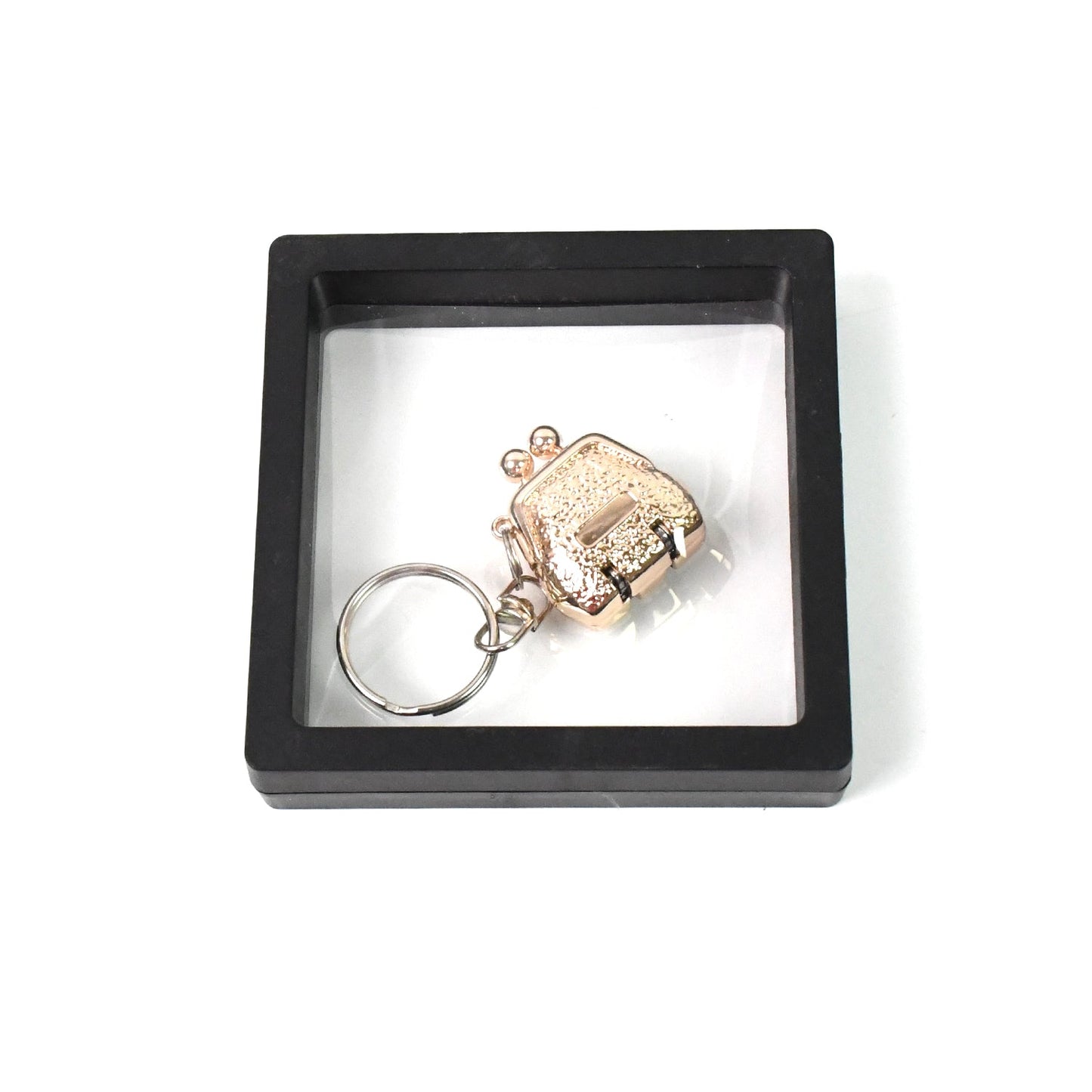 Mini nail clipper keychain in clear showcase with 3D floating effect