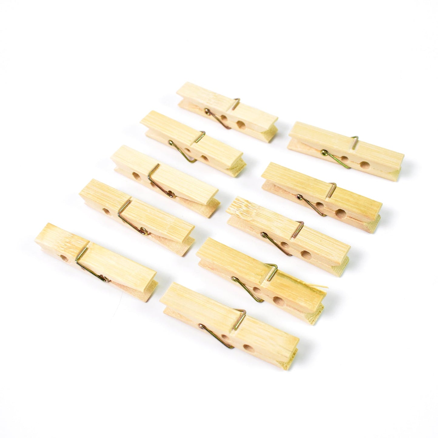 Sturdy wooden clothes pegs made from bamboo arranged for a clear product view.